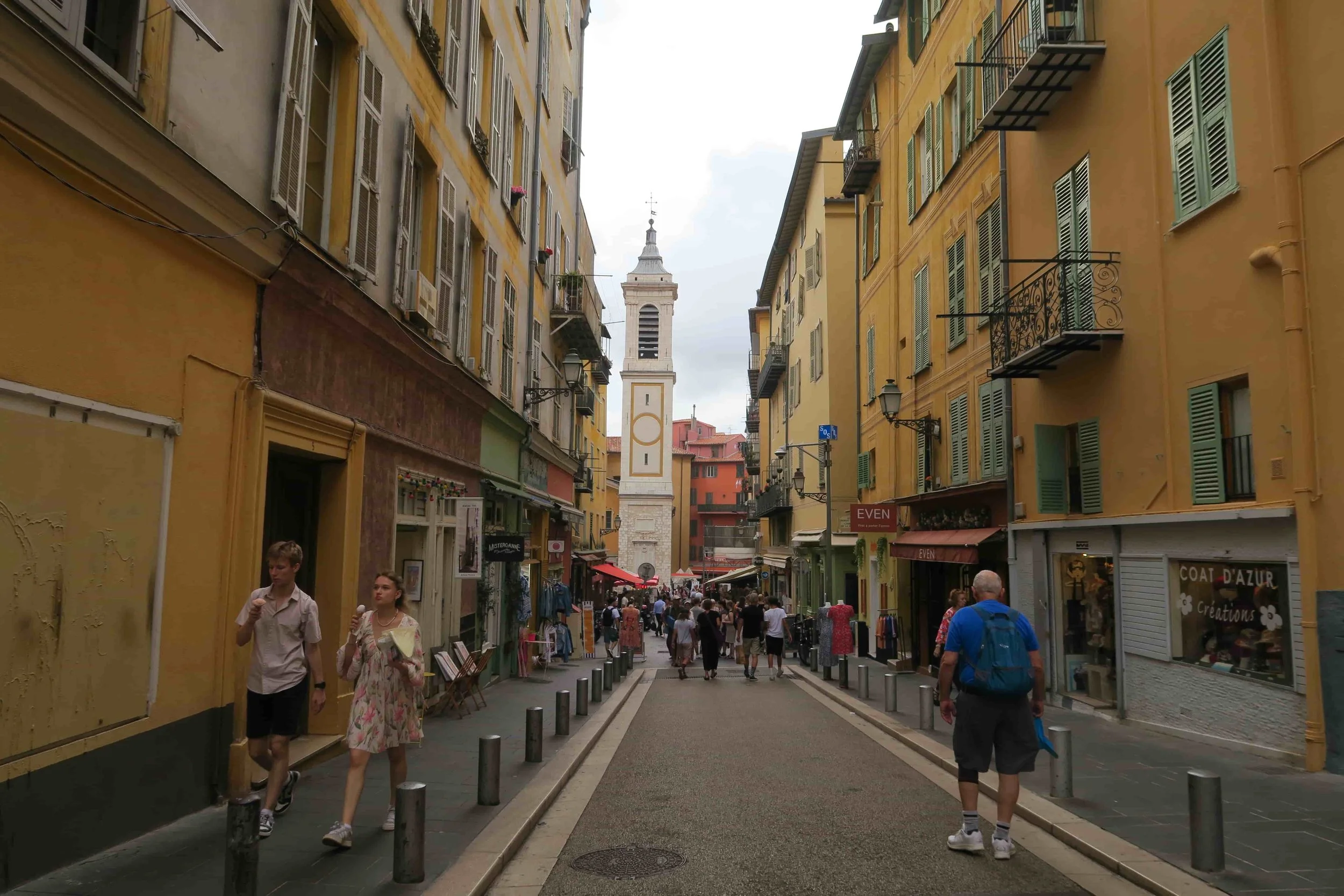 old town with narrow streets yellow buildings and clock towers
