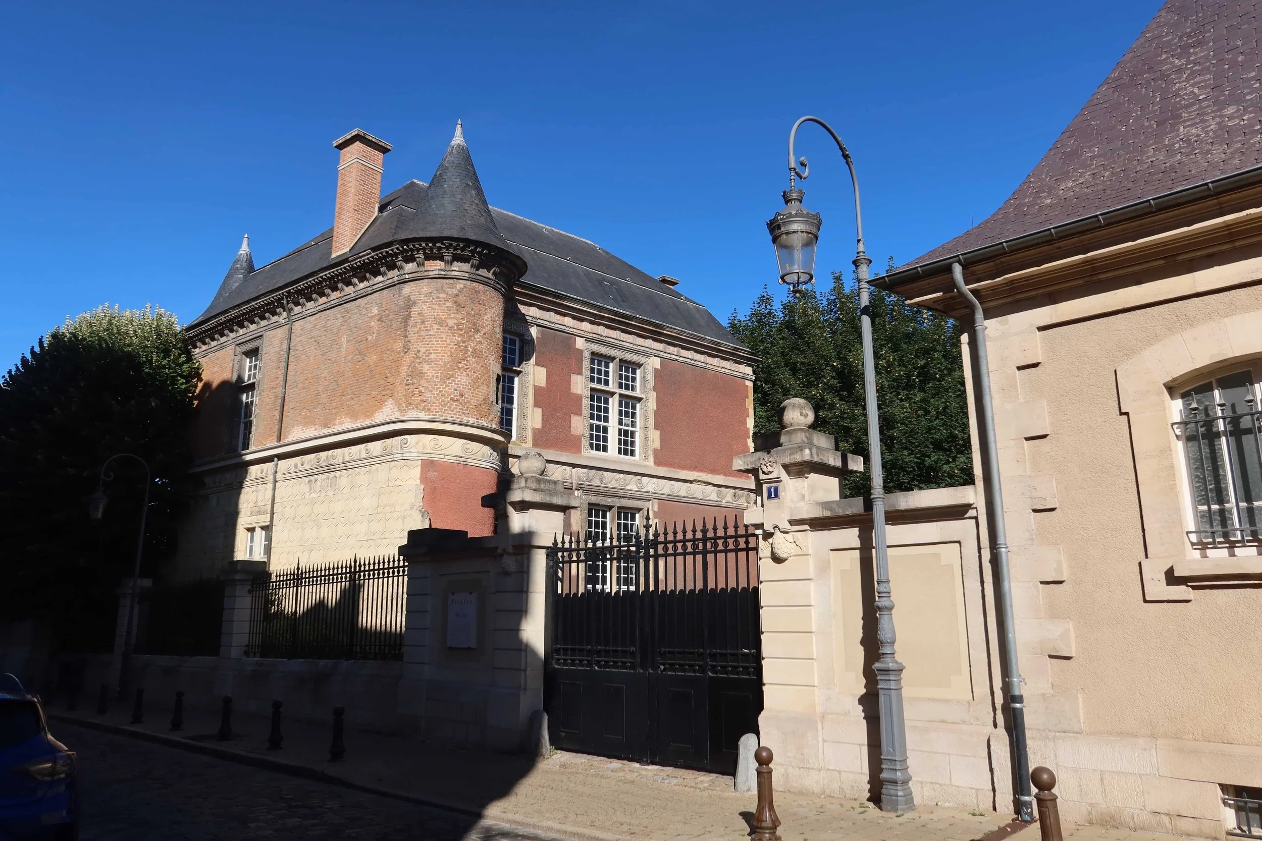 black iron gate french and pointed castle-like building