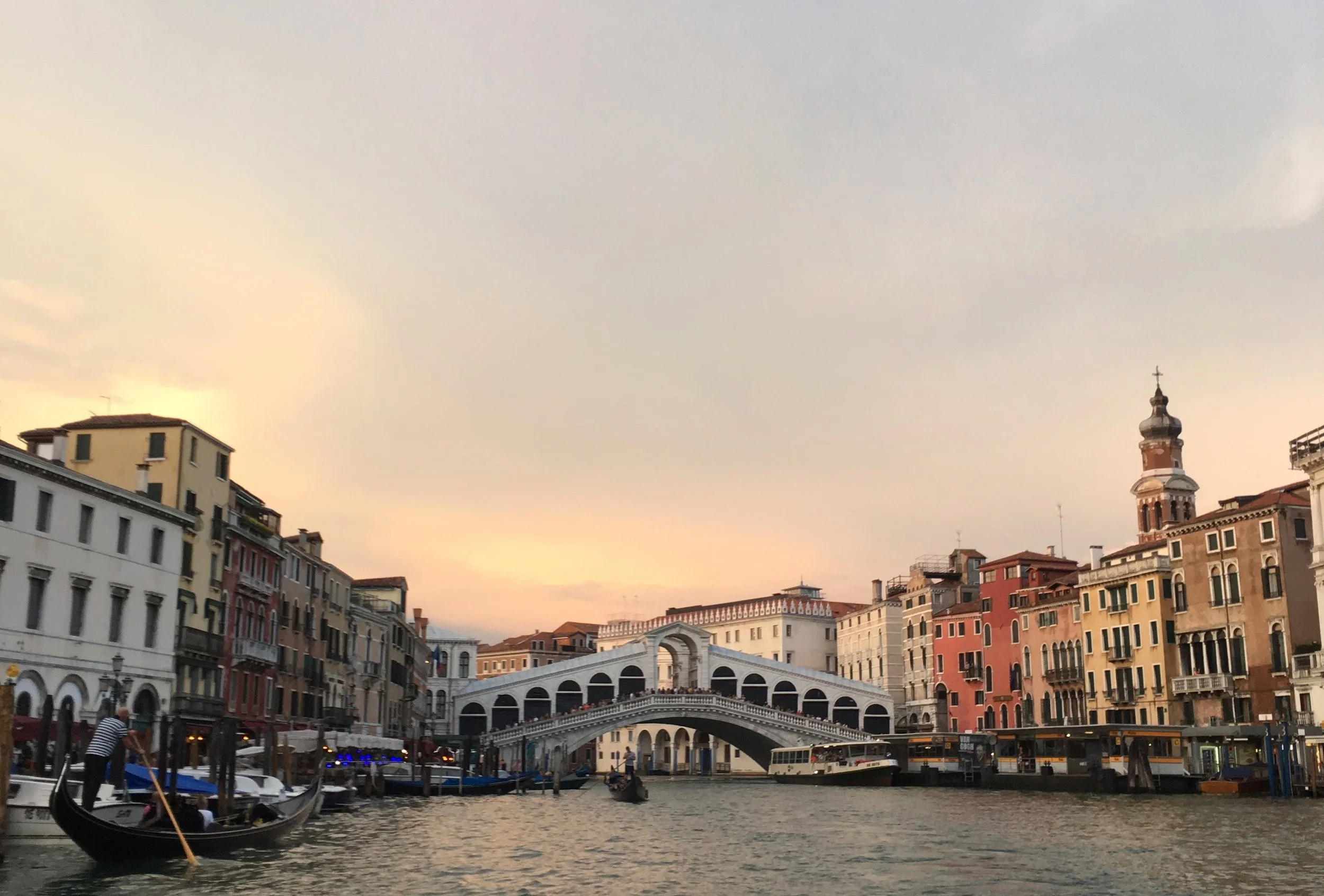 white bridge at sunset on water in venice