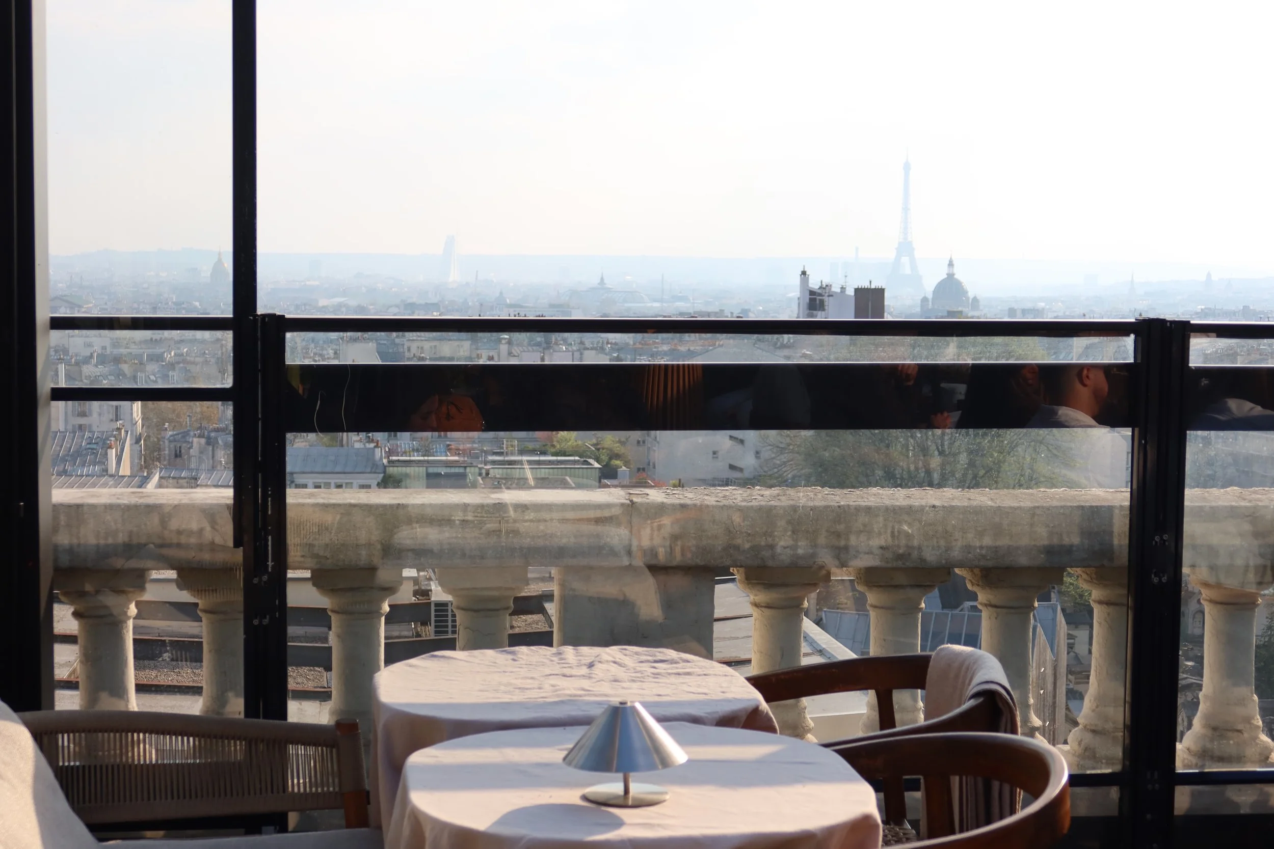 white tables with paris eiffel tower view