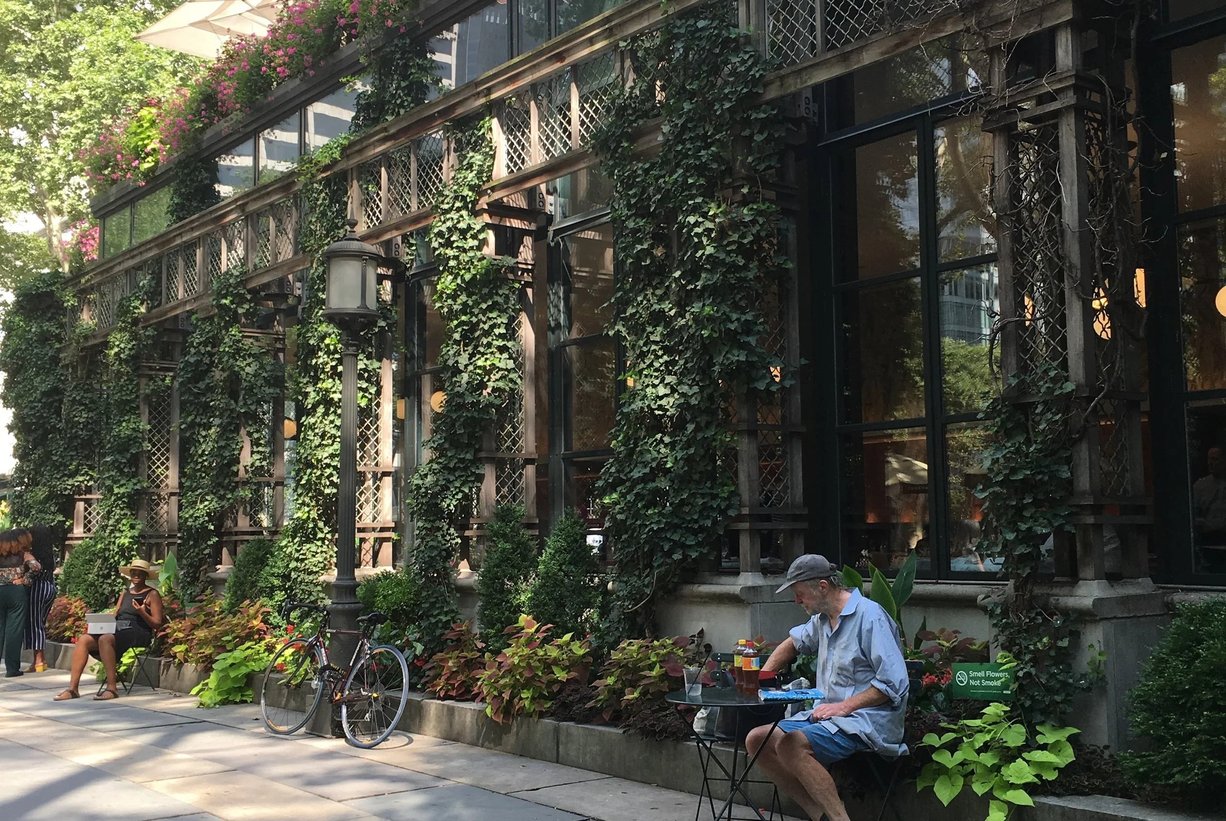 charming park in the summer with chairs and bikes and flowers