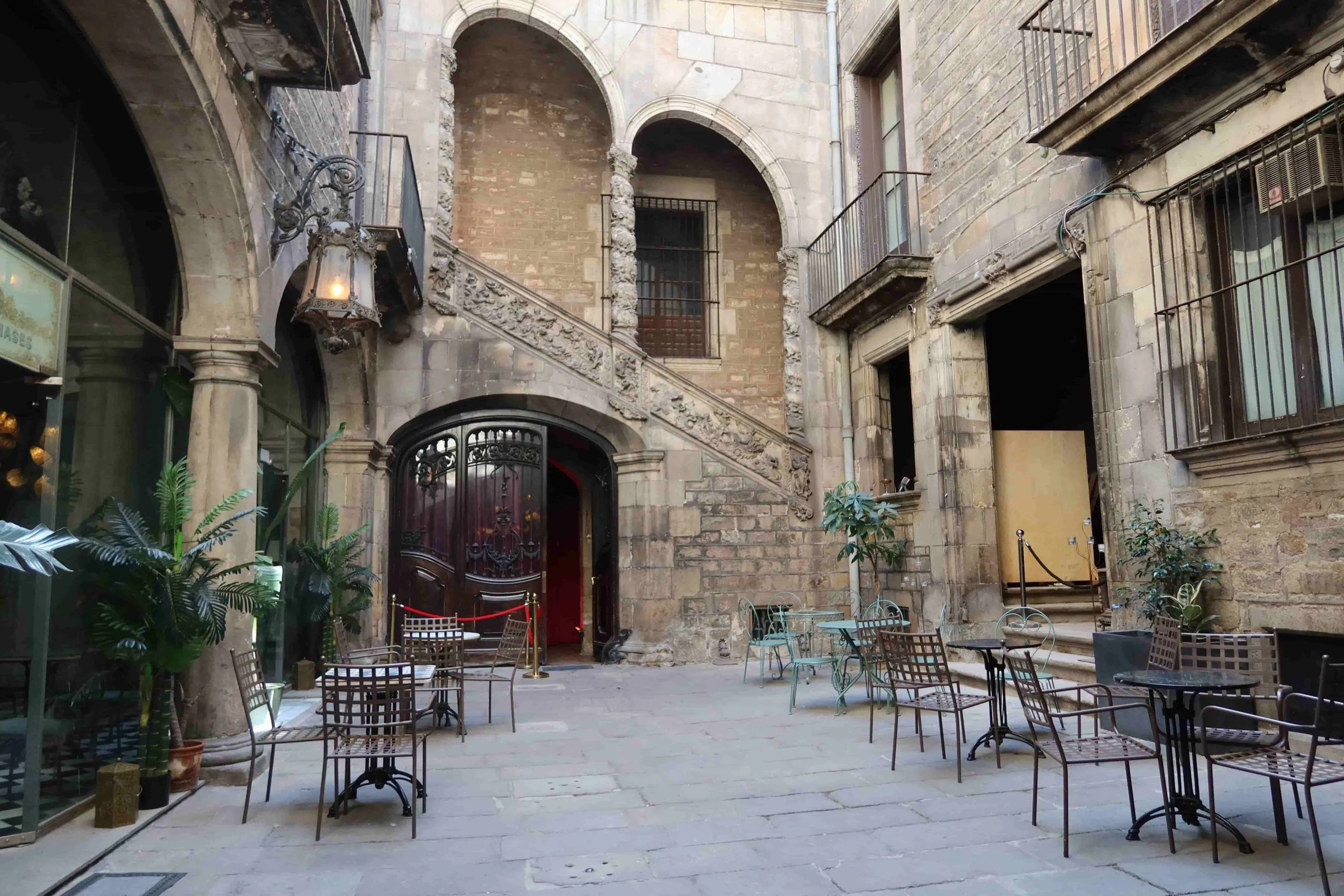beautiful cafe in barcelona with starcase and patio setting