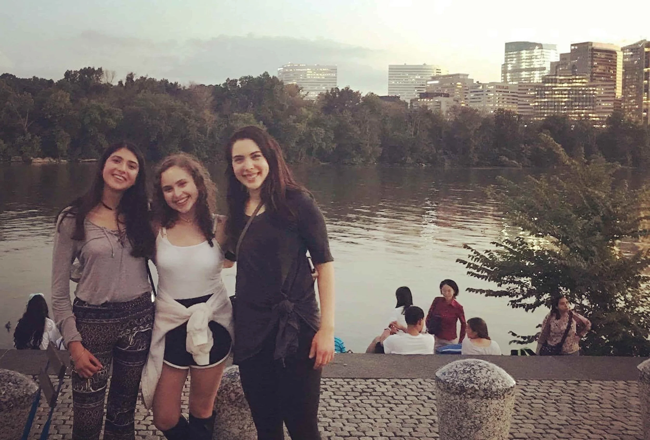 teen girls smiling at waterfront