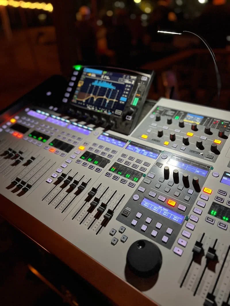 Digital mixing console with LED meters during live sound engineering event
