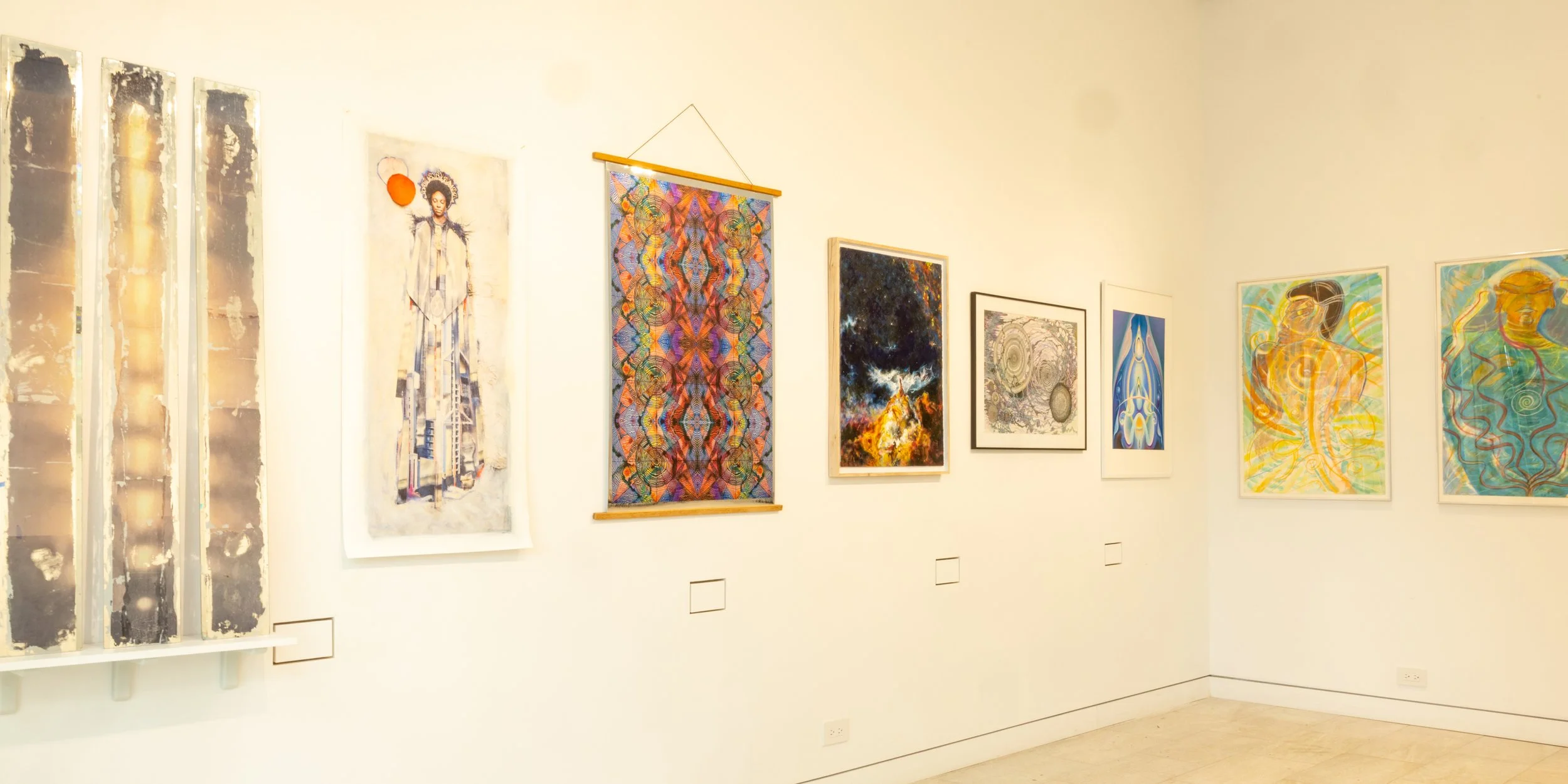 gallery walls with paintings and glass sculpture including figures and abstract subjects