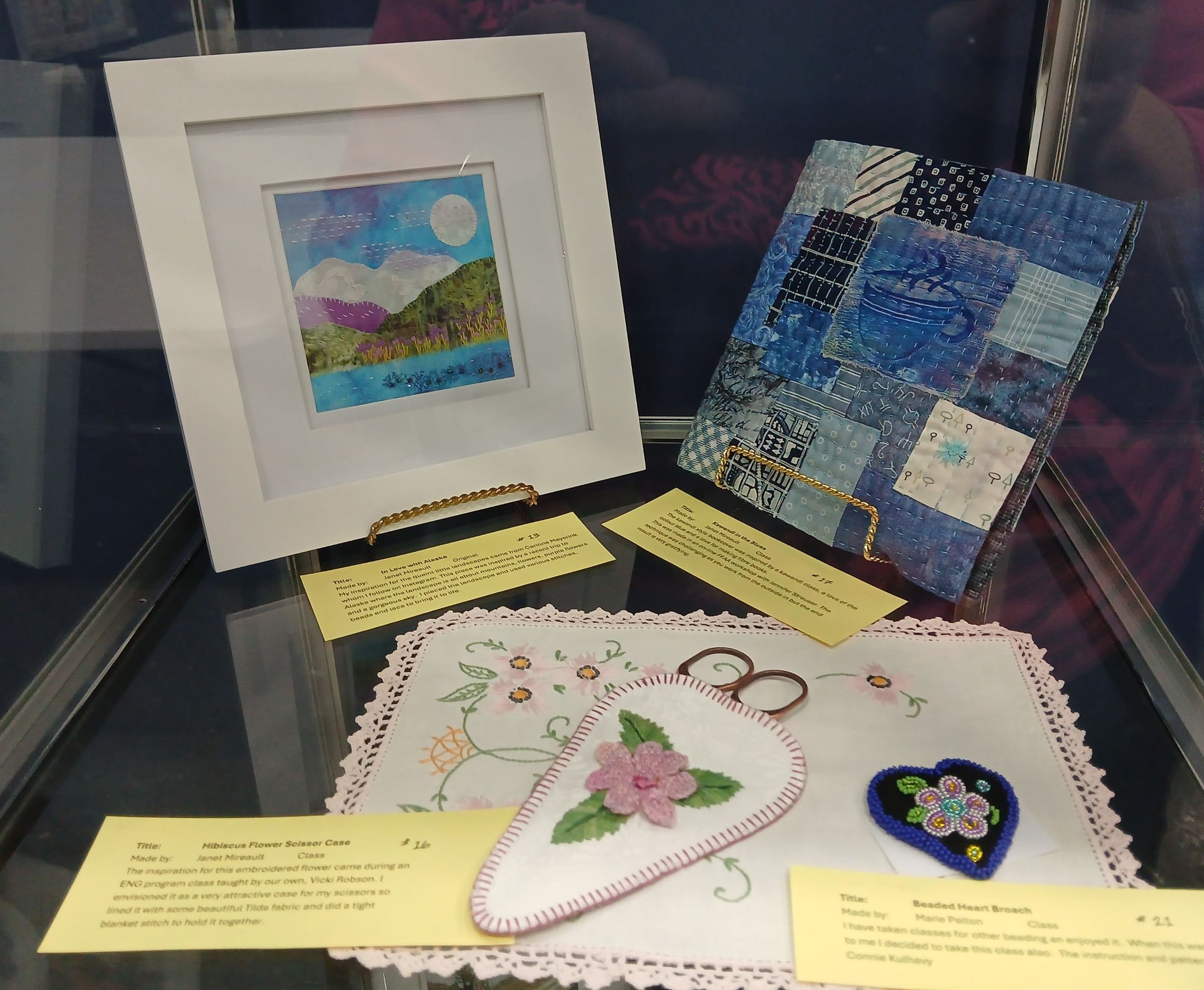 In Love with Alaska (top left) Designed & stitched by Janet M. / Fabric landscape with stitching, beads & lace, inspired by a recent trip to Alaska Kawandi in the Blues (top right) Stitched by Janet M. / The Kawandi style book