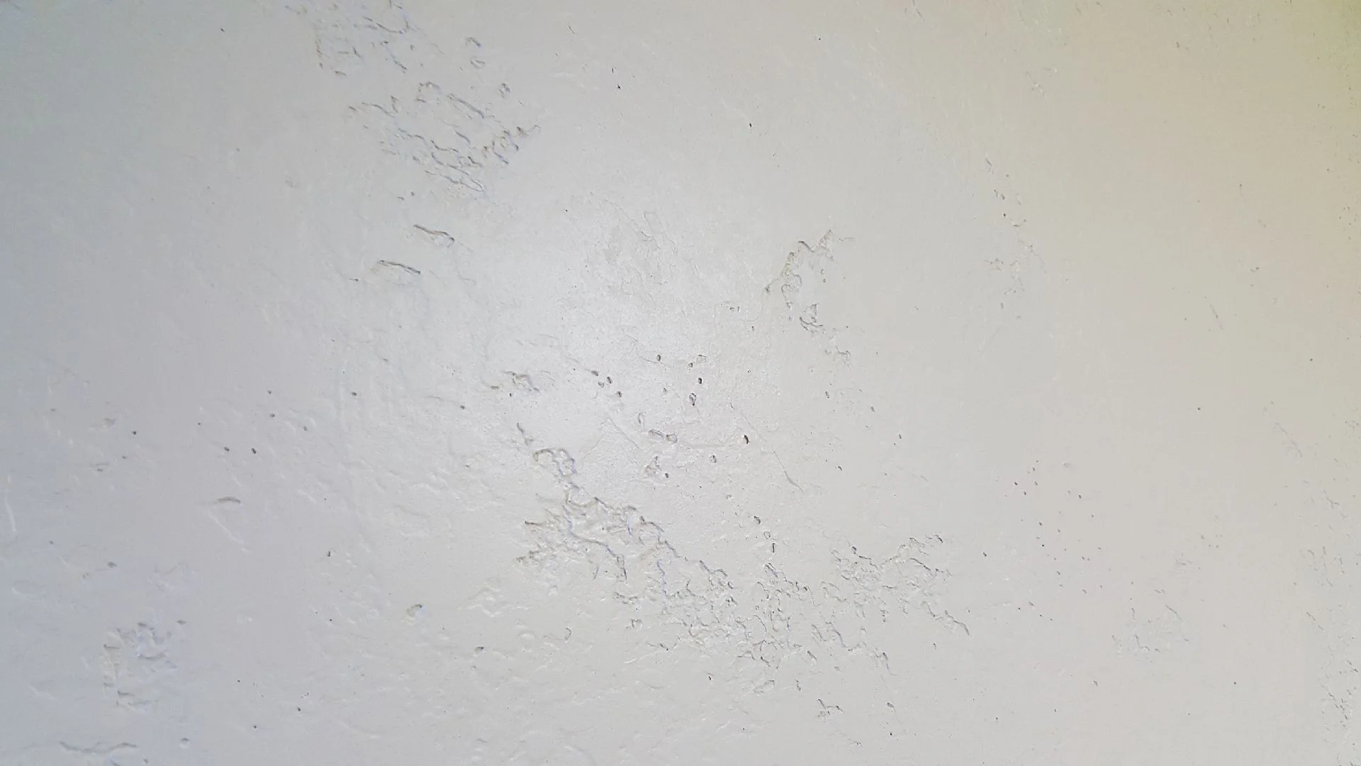 Subtle trowel texture over orange peel with a solid color paint