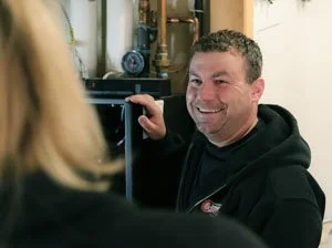 Friendly Anchorage Plumber talking to customer