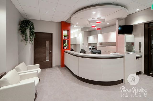 Dental reception desk- serene scheme with a sensory shock of red.  Click on our website link in our profile for more of our projects. #interiordesign #design #designer #customdesign #dental #reception #interiordesigner #dentaldesign #yyc #yycdesign #