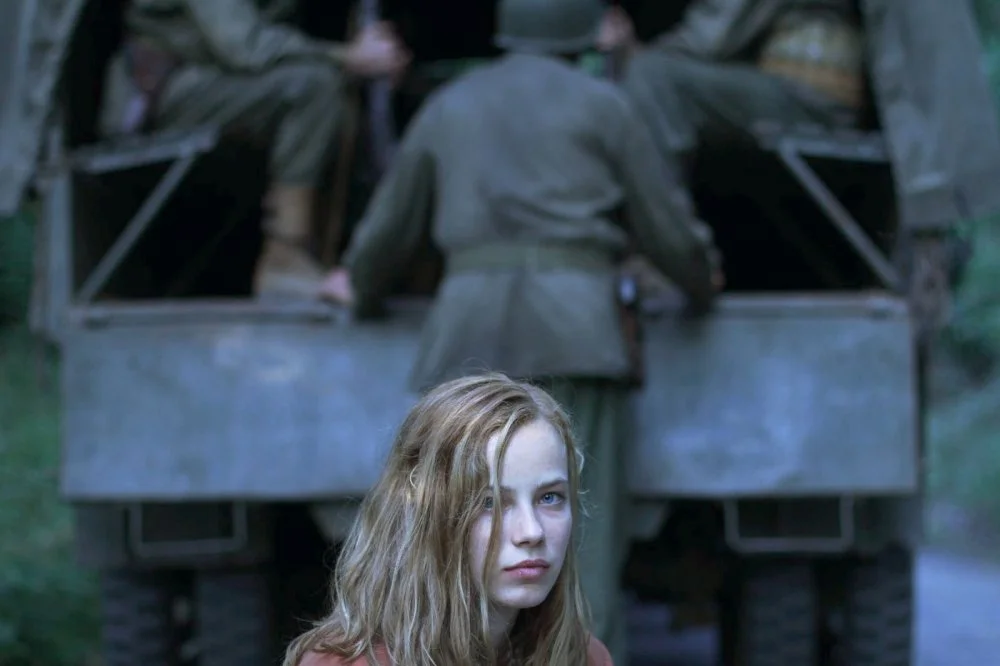 lore-2012-004-lore-in-front-of-army-truck.jpg