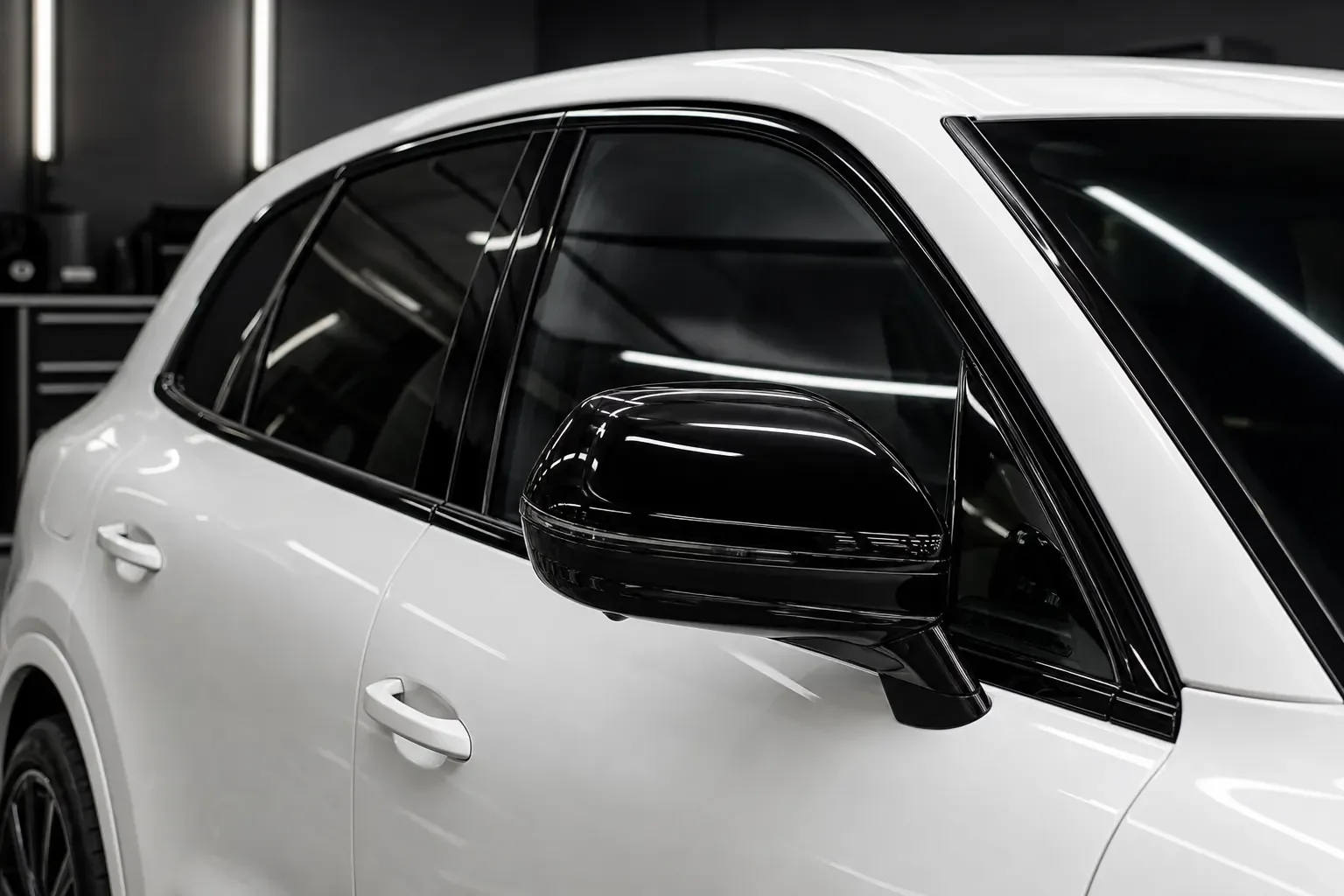 Gloss black vinyl chrome delete installed on a white luxury SUV near Pittsburgh, PA