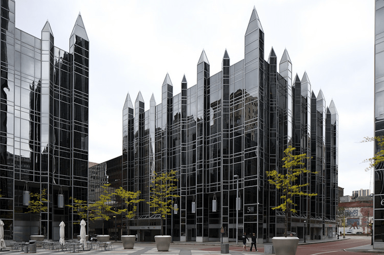 Combination of window tint and solar roller shades installed in a Verona PA commercial space