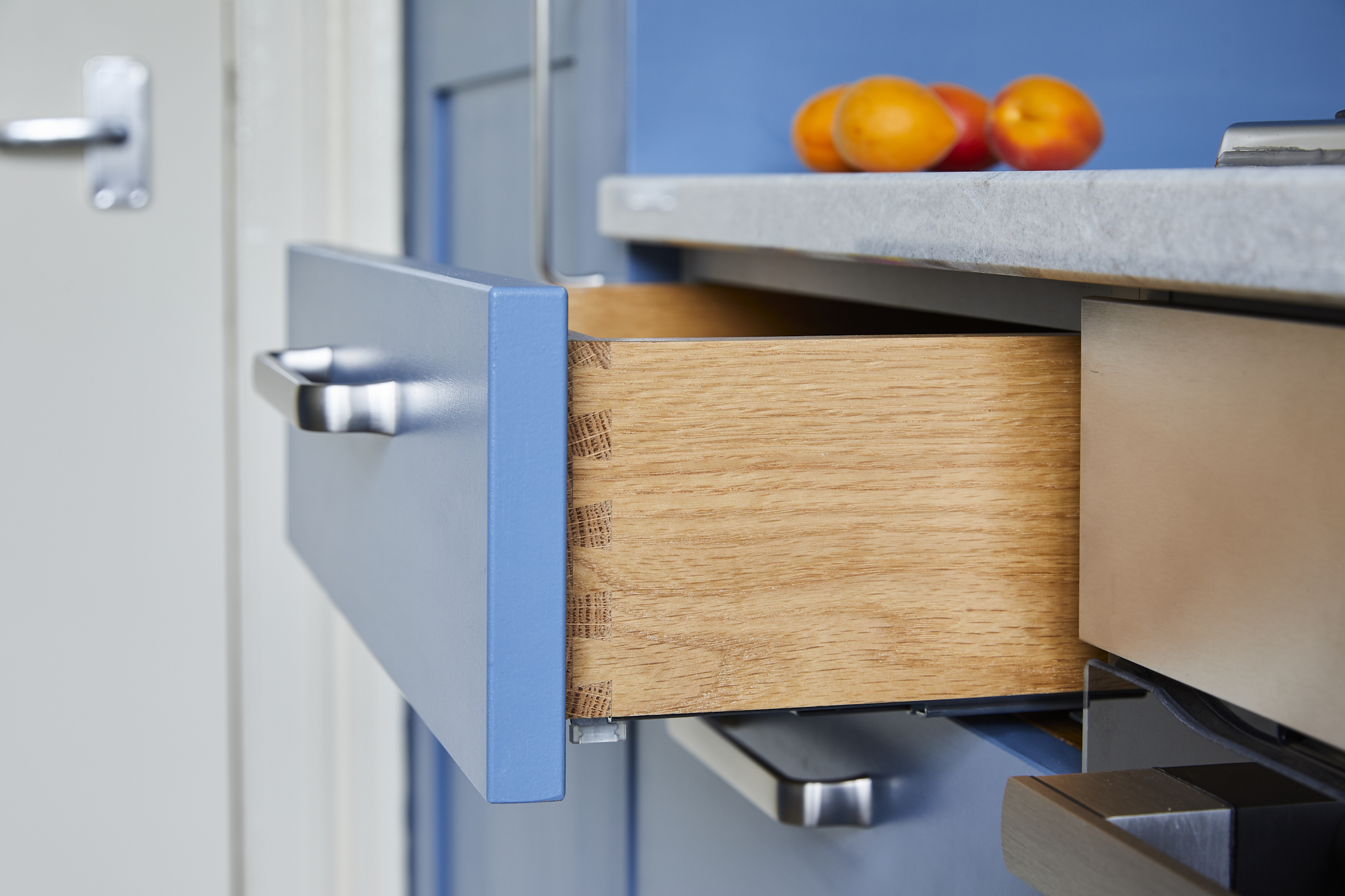 Solid oak dovetailed kitchen drawers made bespoke to fit.