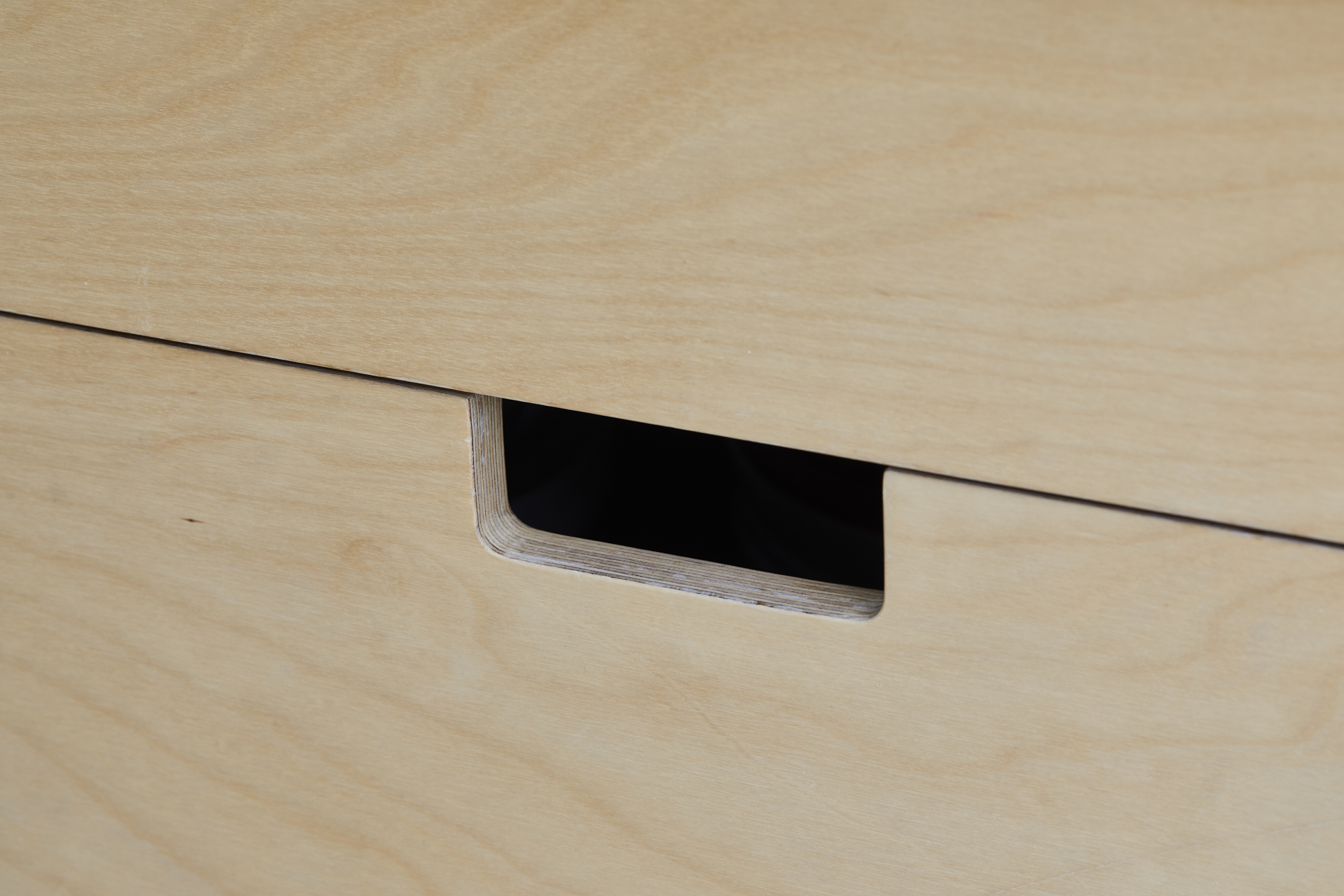 Custom made kitchen design in East London - detail of light wood cabinet door handle