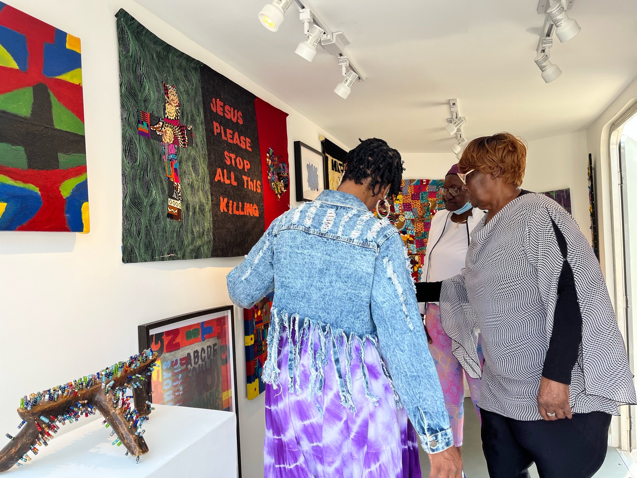 Ms. Mary shares her works with her daughter.
