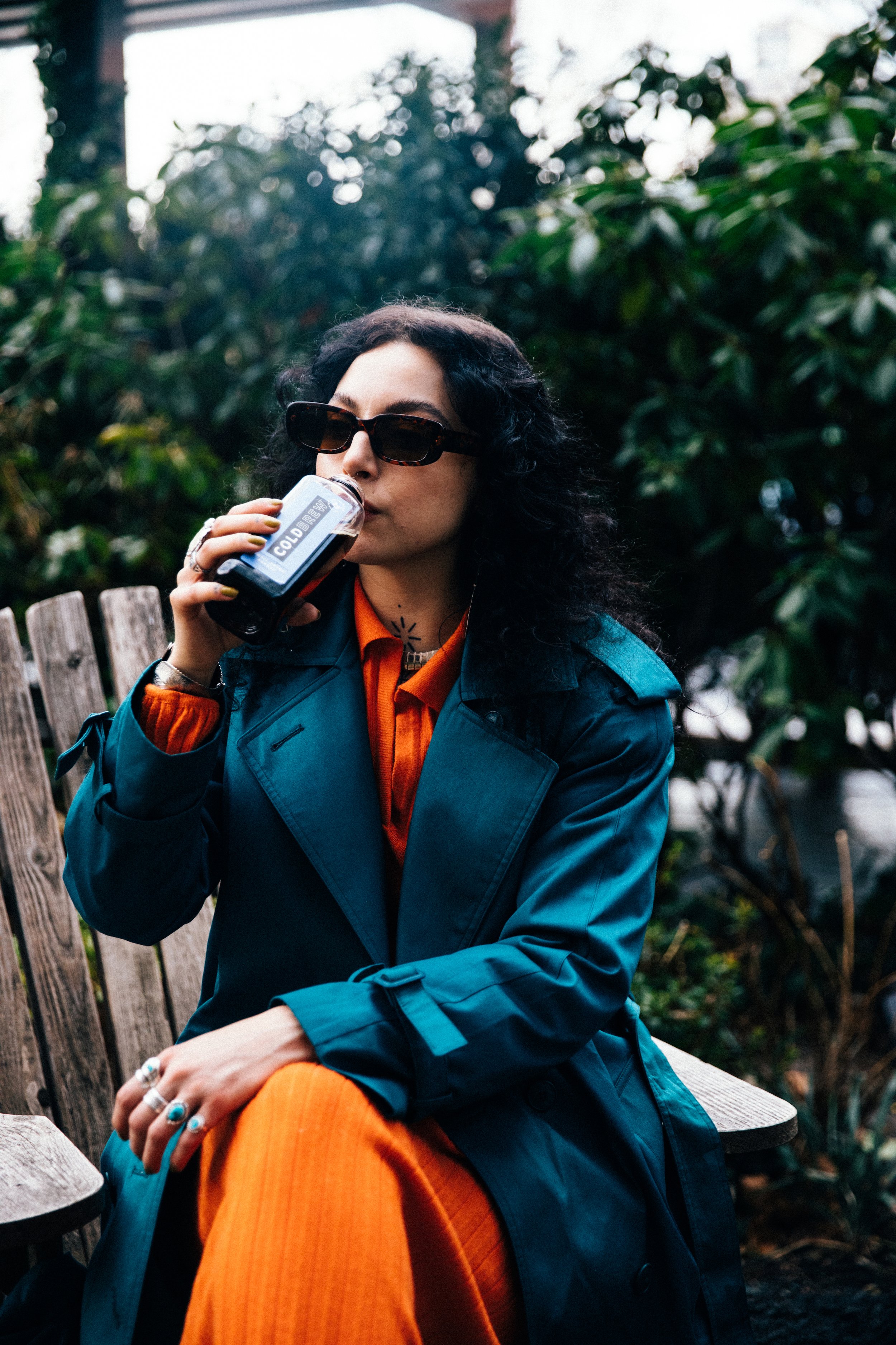 Sitting on a Chair Drinking Bean2Bean Cold Brew, Photo by Corey Jermaine