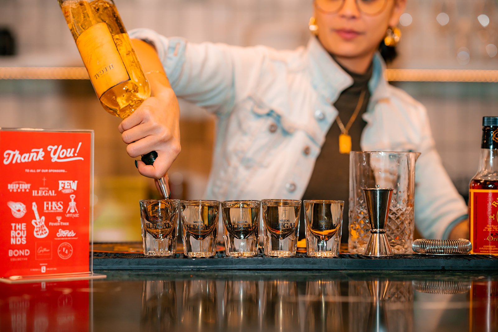 jill pouring ilegal mezcal shots at Bond Collective Center City event for Bean2Bean Coffee Co photo by Daniel Knoll