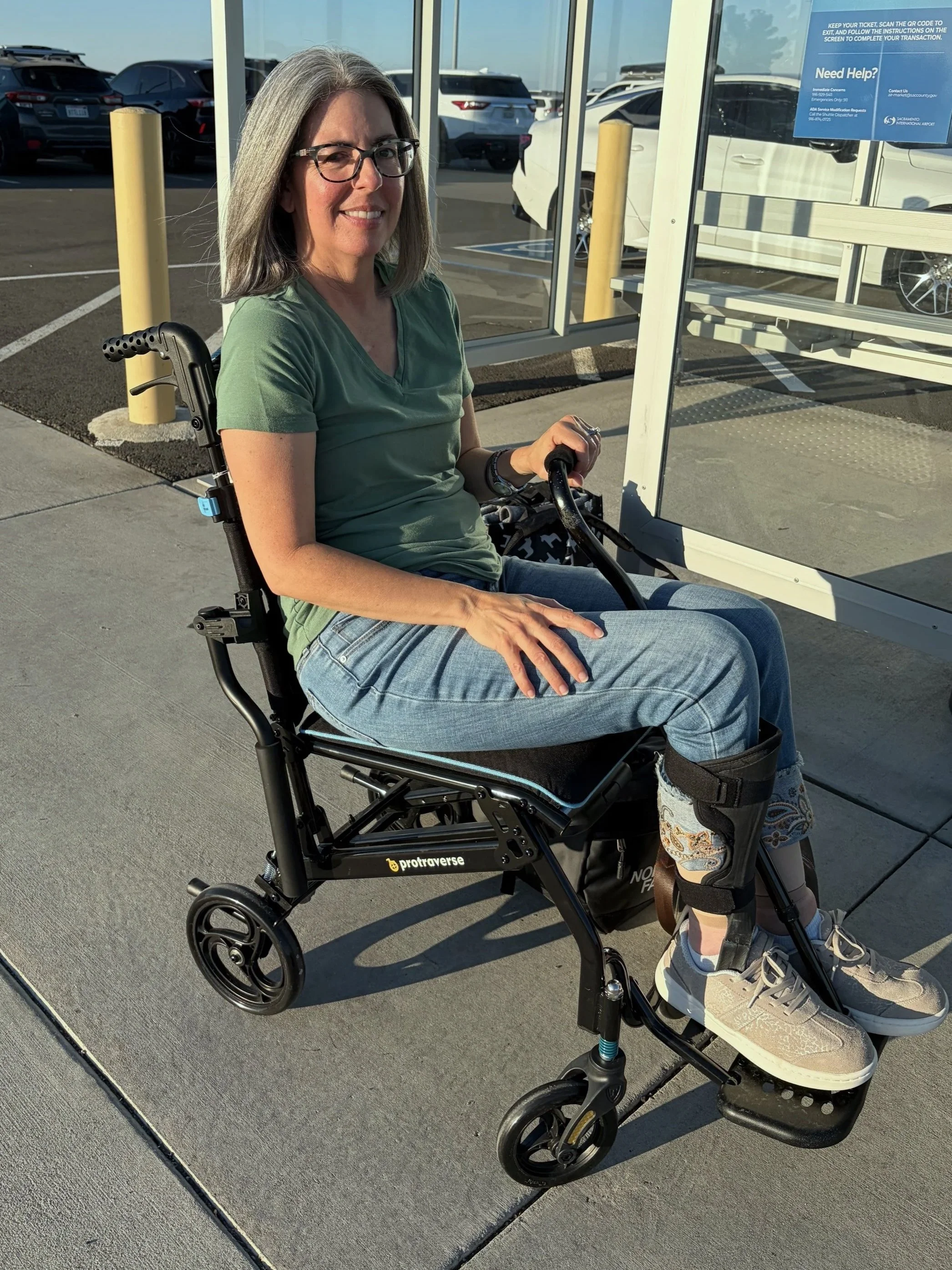 me in the Protraverse Ultralight Transfer Chair in an aiport park lot