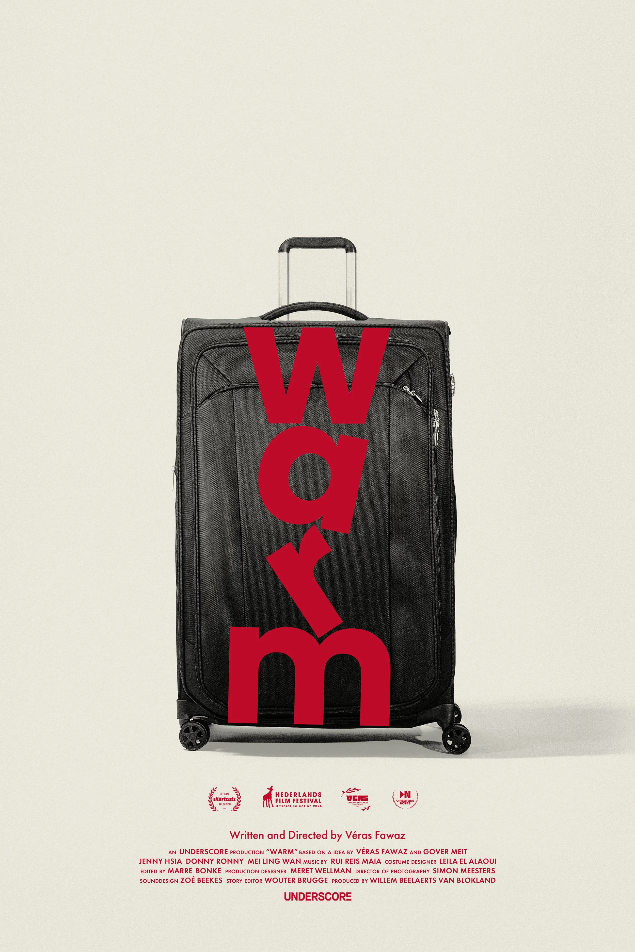 A black suitcase on a plain background with the word 'Warm' written vertically in large red letters across the front.