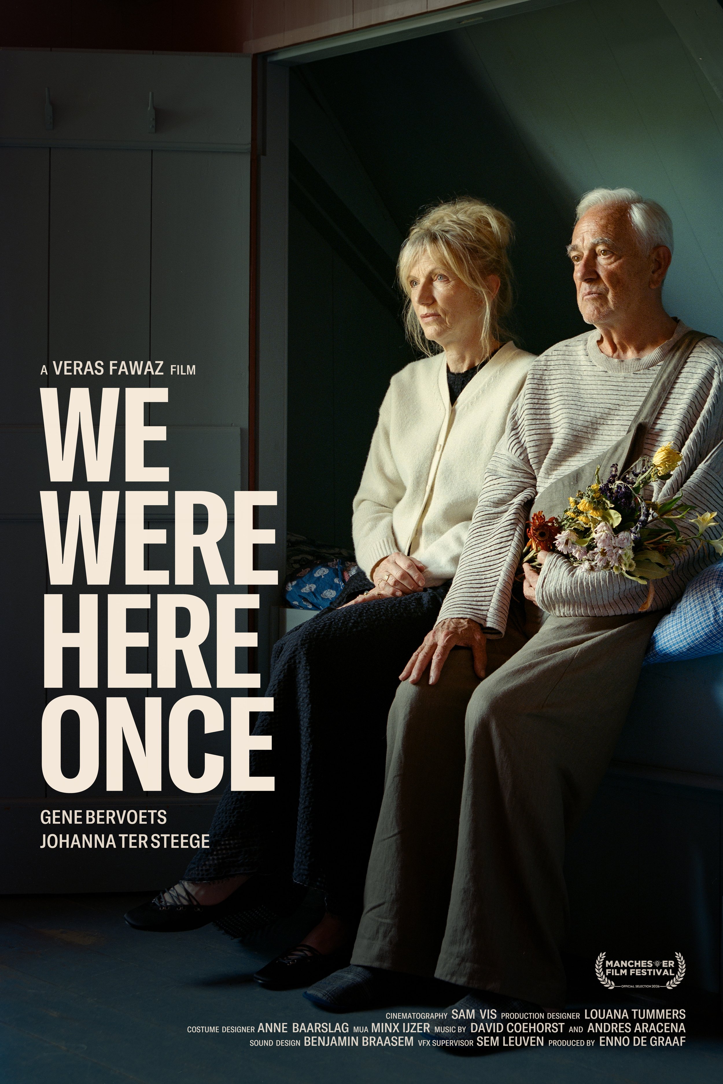 A poster for the film 'We Were Here Once', featuring an older man and woman sitting on a bed, the man holding a bouquet of flowers, both looking serious.