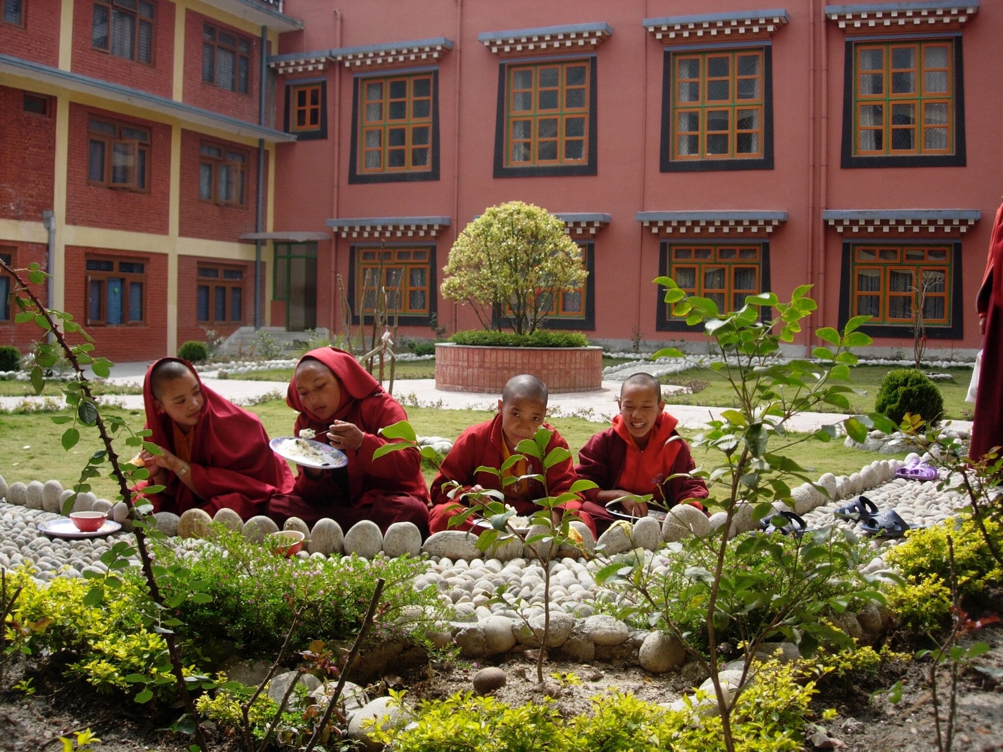  Young nuns enjoying lunch in the garden at Tara Abbey 