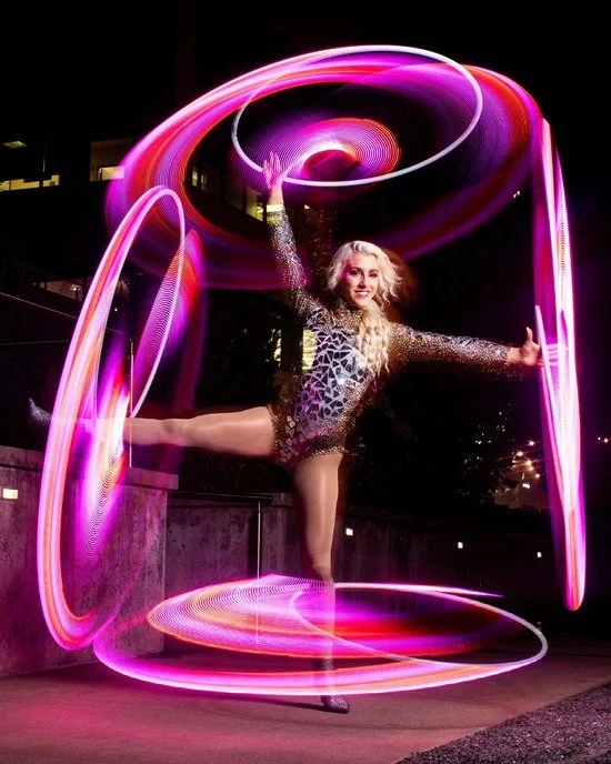 Grace Good with four LED Hoops that are pink and red