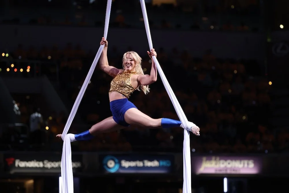 Grace Good performing aerial halftime show for Seattle Storm at Climate Pledge Arena