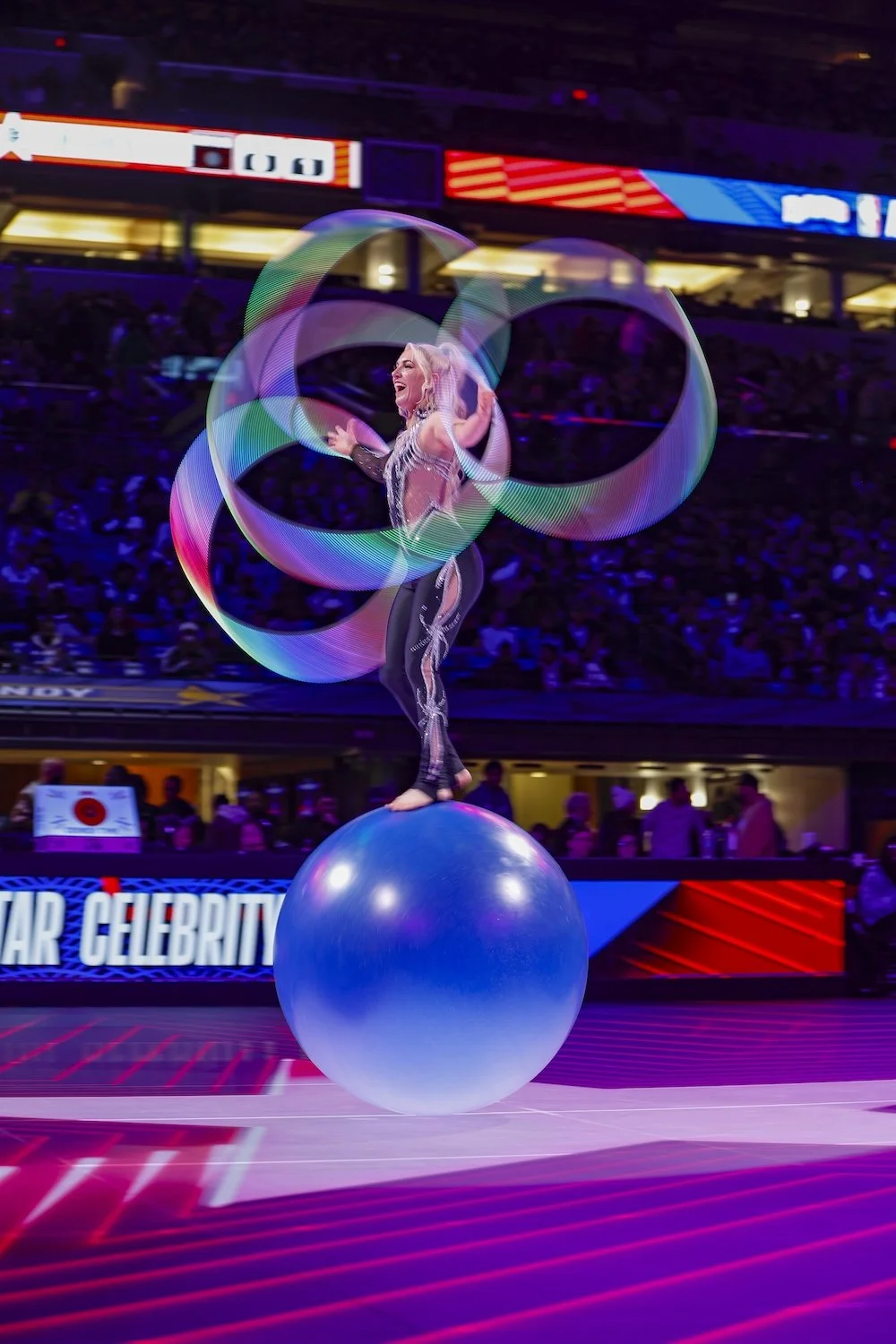 Grace Good featured halftime show with hula hoops on big blue ball