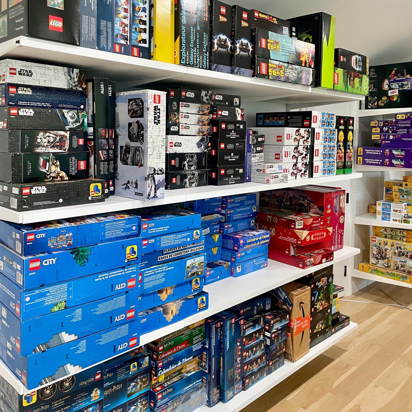Here to make your Lego dreams come true! We installed shelving on two of the walls to hold all of the boxes that have not been built yet, organized by theme. We then built 7 drawer units to hold loose legos underneath a row of shelves to showcase the