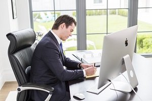 Nick Oberheiden working at his desk