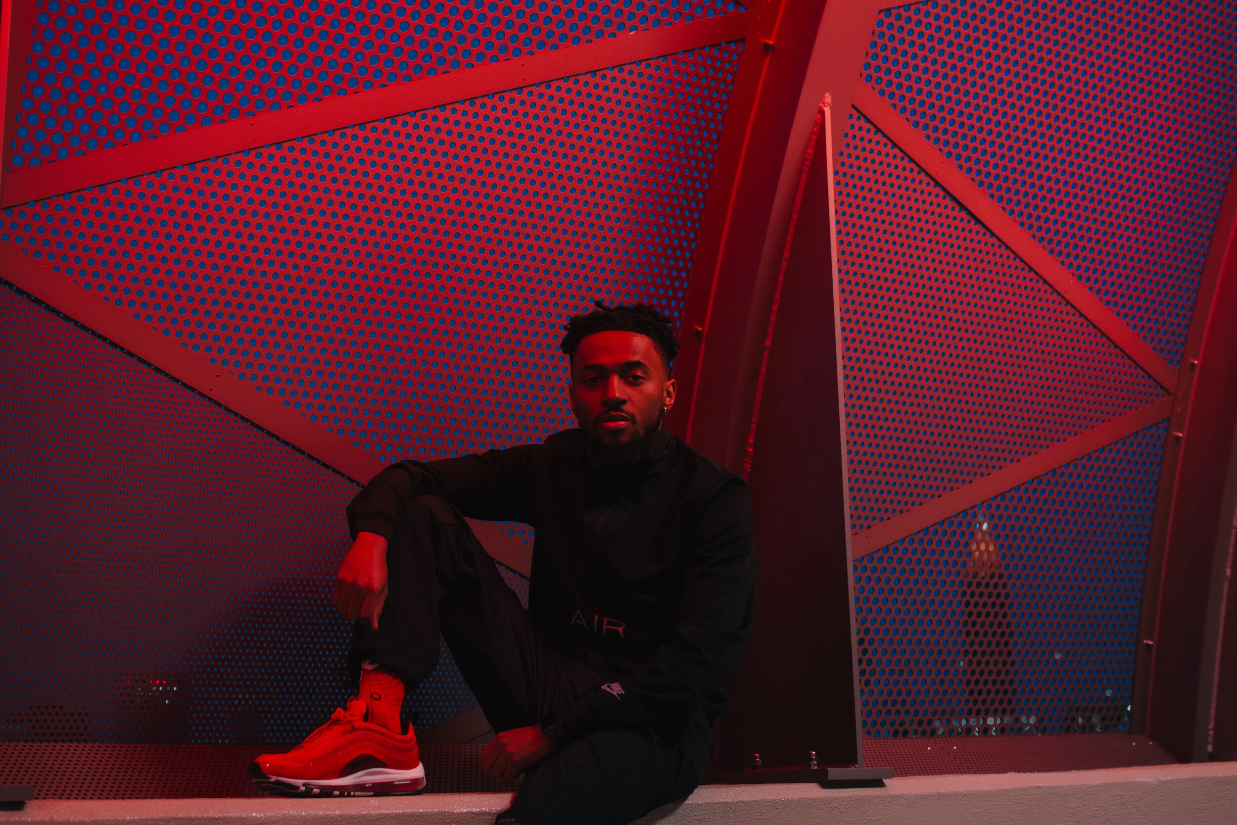 Bakari B. Photo Taken By Essence Ransome. Jacket, Sweats, &amp; Shoes By Nike. Socks By Stance.