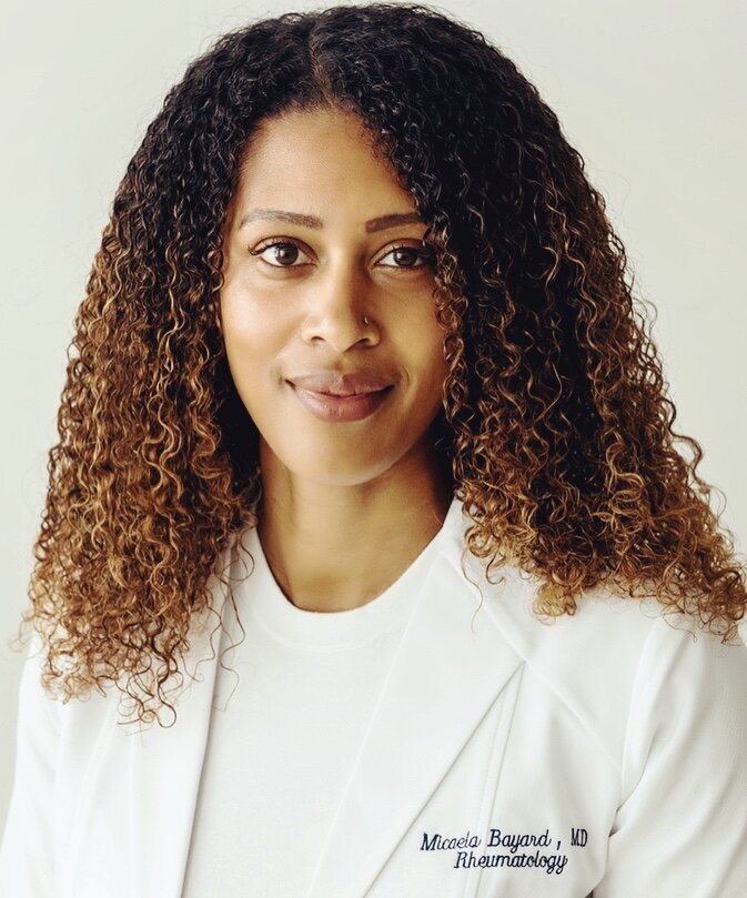 Gio white coat headshot cropped.jpeg