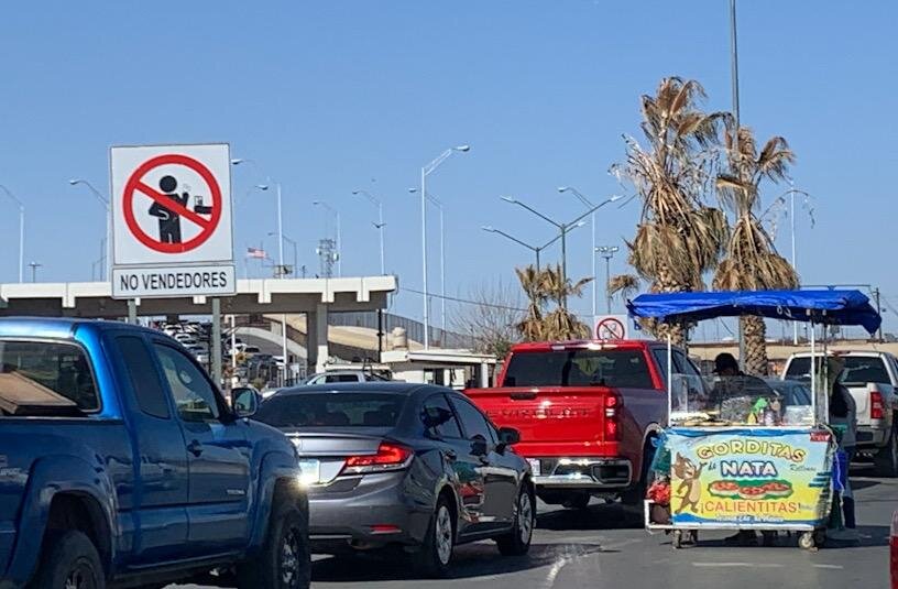 Although crimped by the COVID-19 pandemic and signs barring their presence, street vendors say they must continue to work the lines of hungry, slow-moving border commuters on the Bridge of the Americas connecting Ciudad Juárez and El Paso. Photo by Bryana Andrea Balderrama