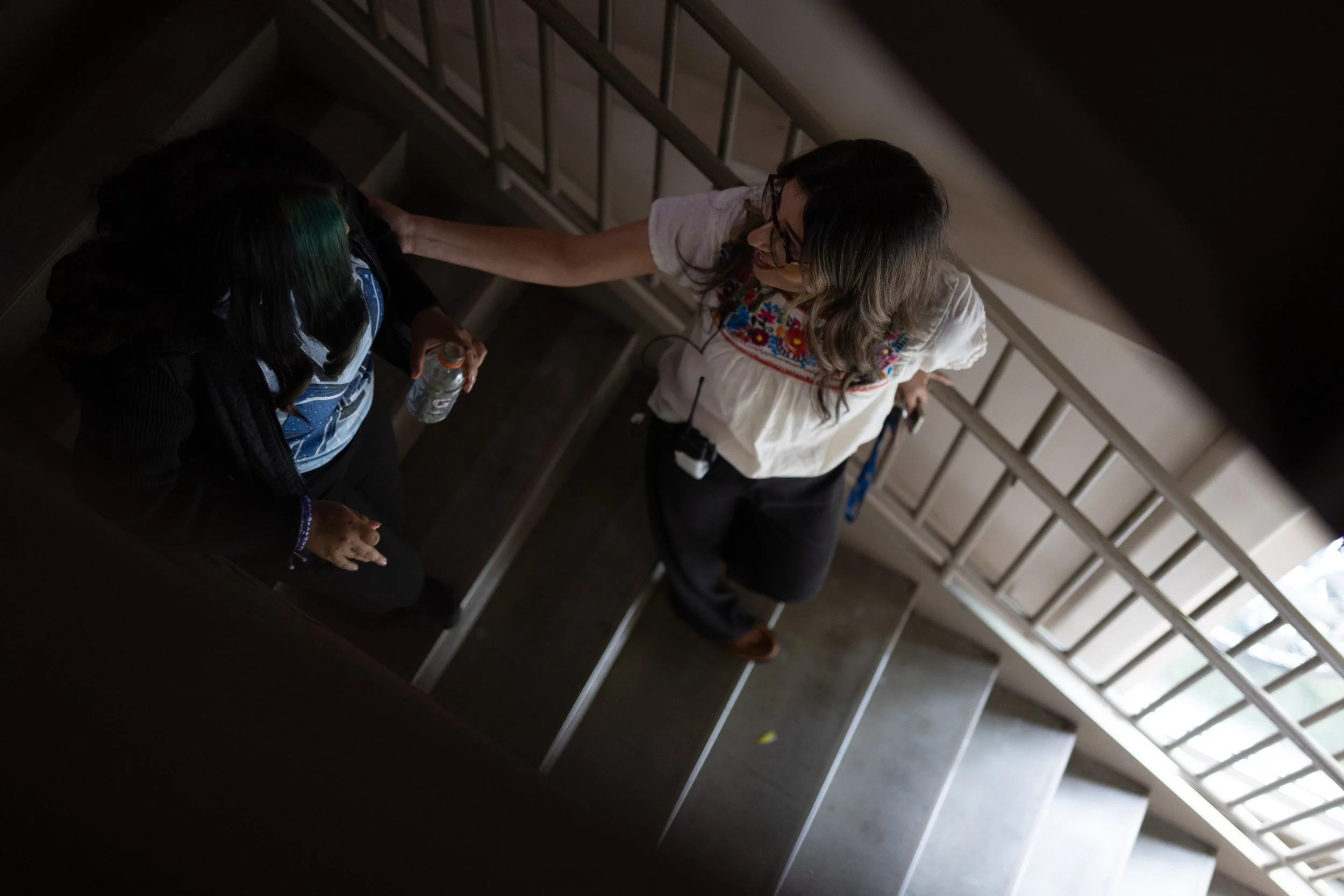   Assistant Principal Lorena Reynoso, 39, speaks with students between passing periods. Reynoso has made building trust with students and families a central part of her work, especially amid the current immigration climate.  