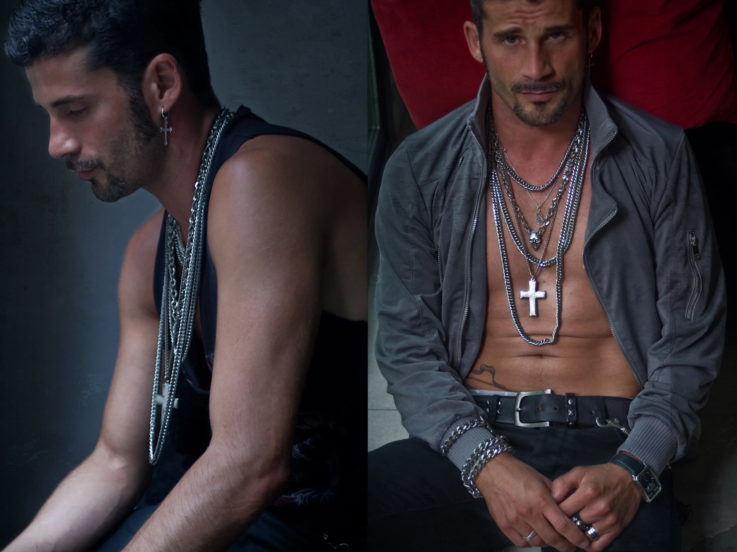Two men with short dark hair and facial hair, wearing multiple silver chains and cross necklaces; the man on the right is shirtless with a gray jacket, sitting on the floor, while the man on the left is in a sleeveless shirt with a dark background.
