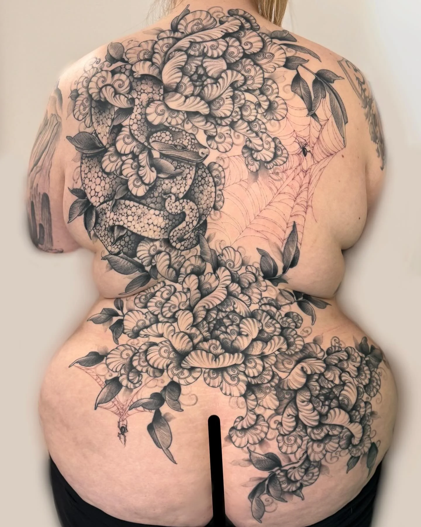 HEALED (except webs) Started April 2023, finished February 2024. Sneaky little snake in a nest of peonies! Thank you SO MUCH Ari for the trust and dedication in getting this piece done! You are genuinely a wonderful human. The commitment for a whole 