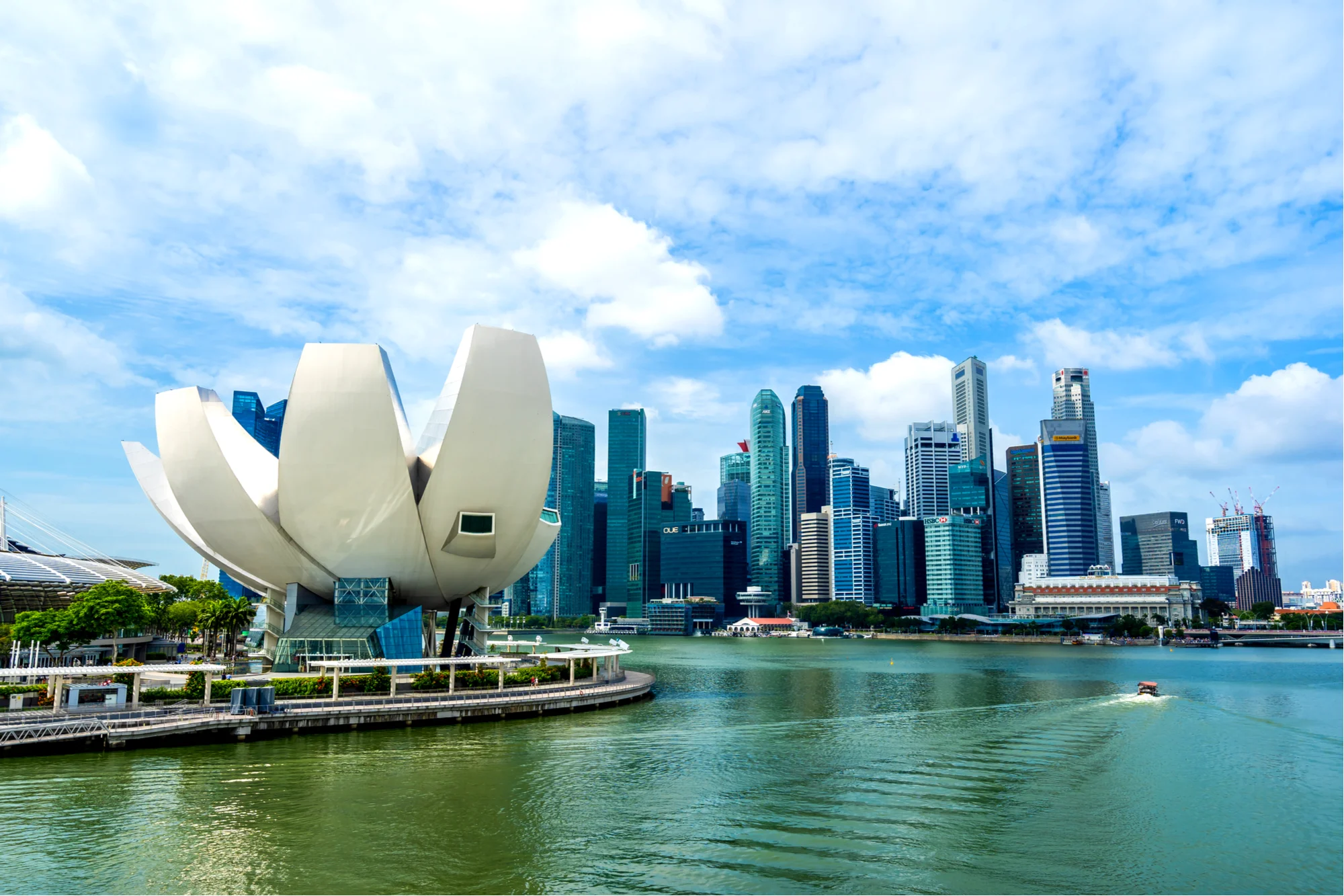 Marina Bay water front with the lotus-shaped ArtScience Museum on the left and skyscrapers in the background