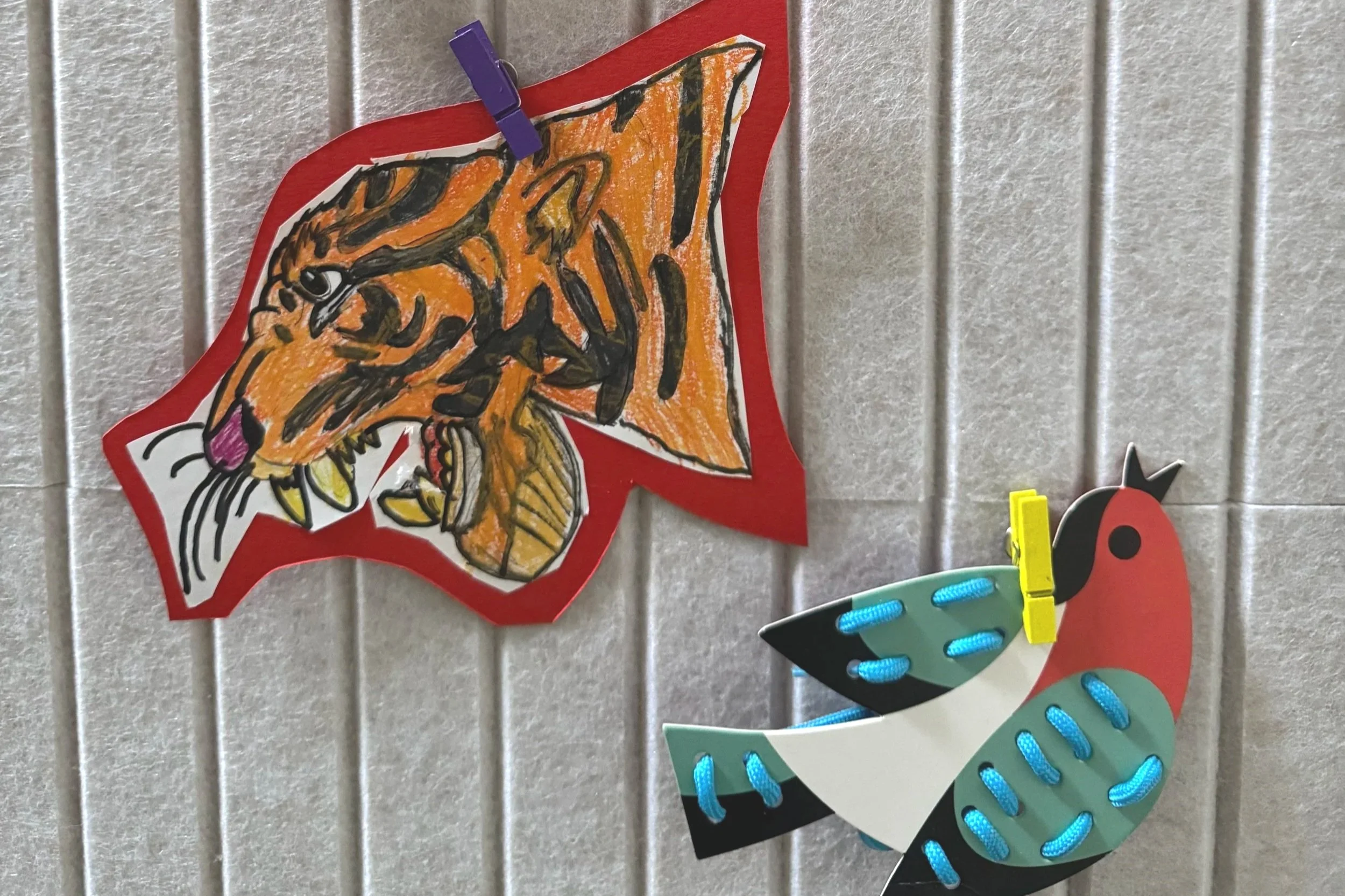 Children's art of a tiger and bird