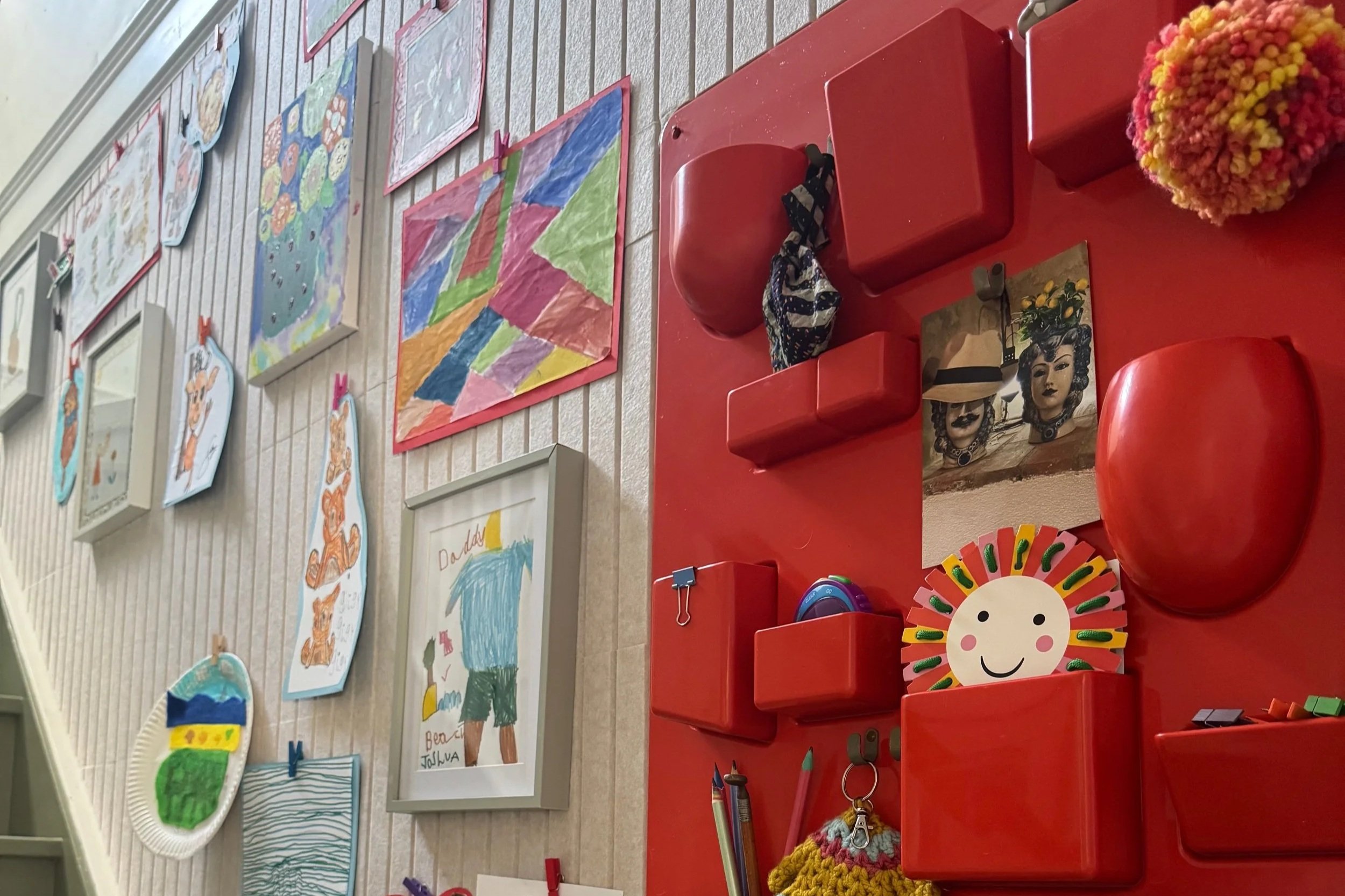 View up the stairs of the art wall