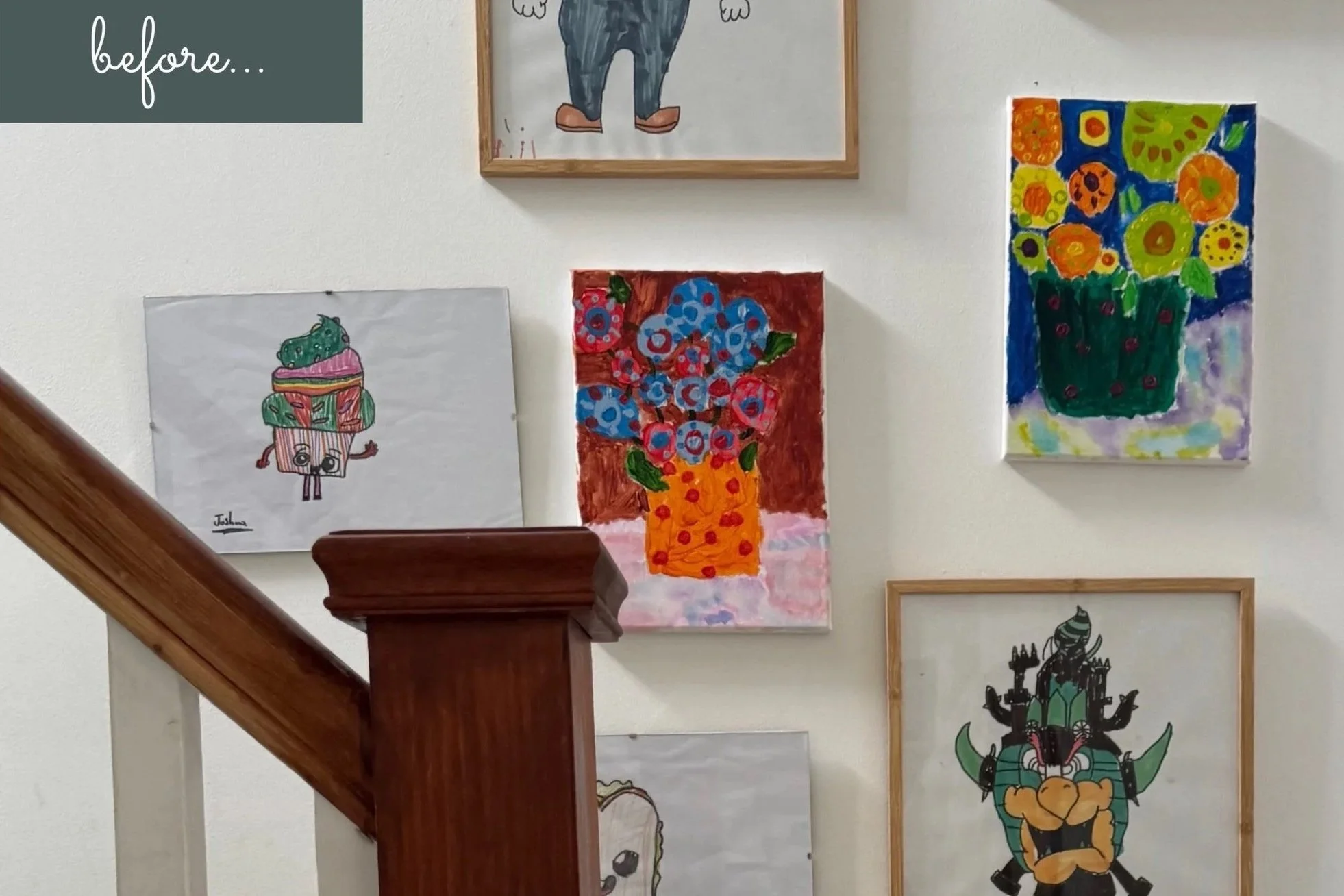 children's  art hanging on white wall on staircase