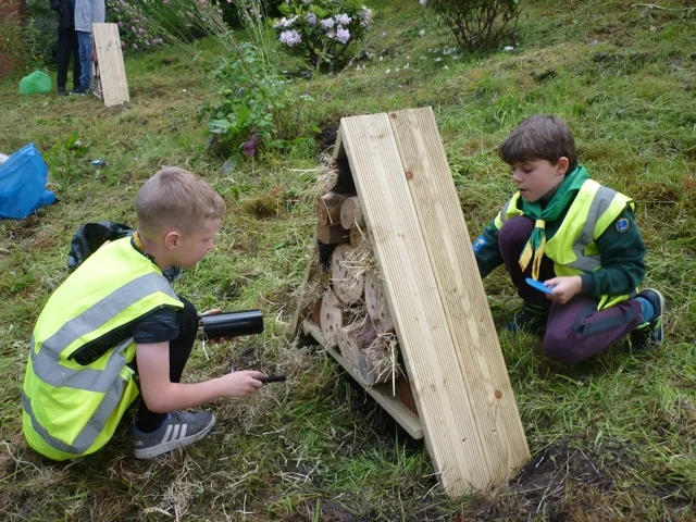 Cubs helping to increase wildlife diversity at Goostrey station by building a bug hotel.jpg