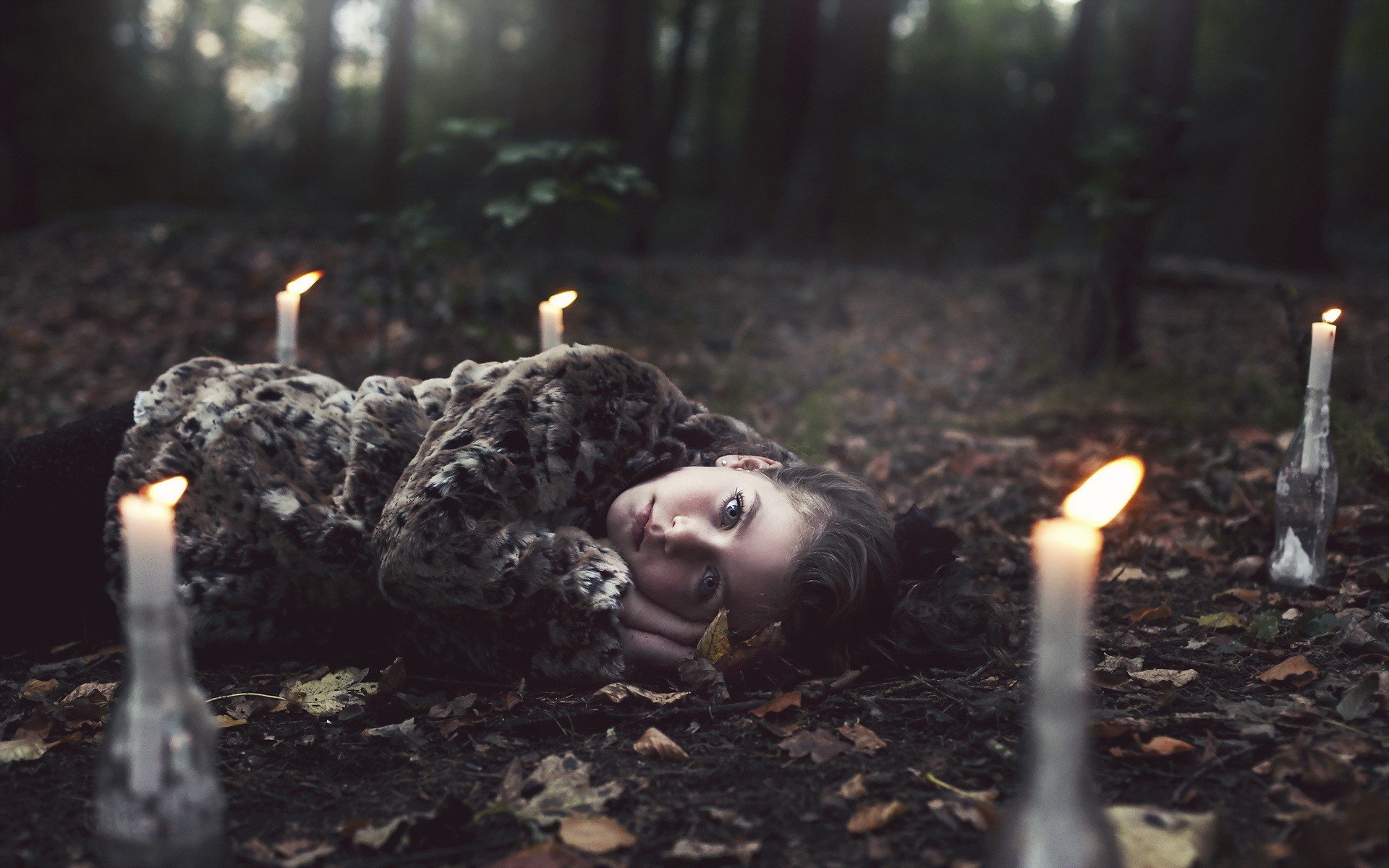 9.Girls_Girl_lying_among_candles_in_the_forest_101515_.jpg