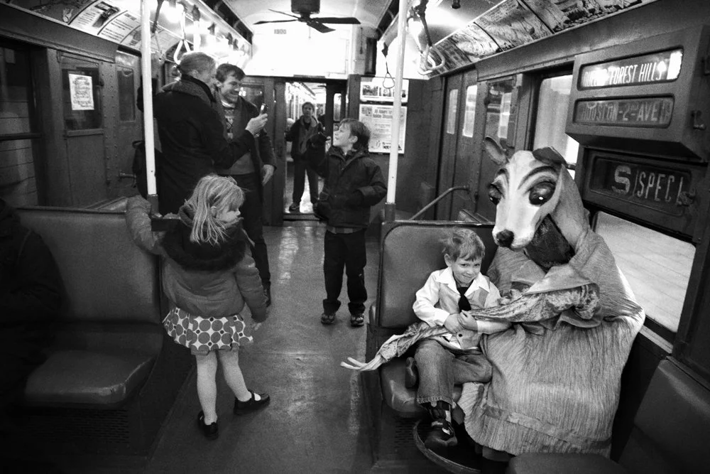 whimsical photograph of a little boy and his imaginary friend on the NYC vintage subway