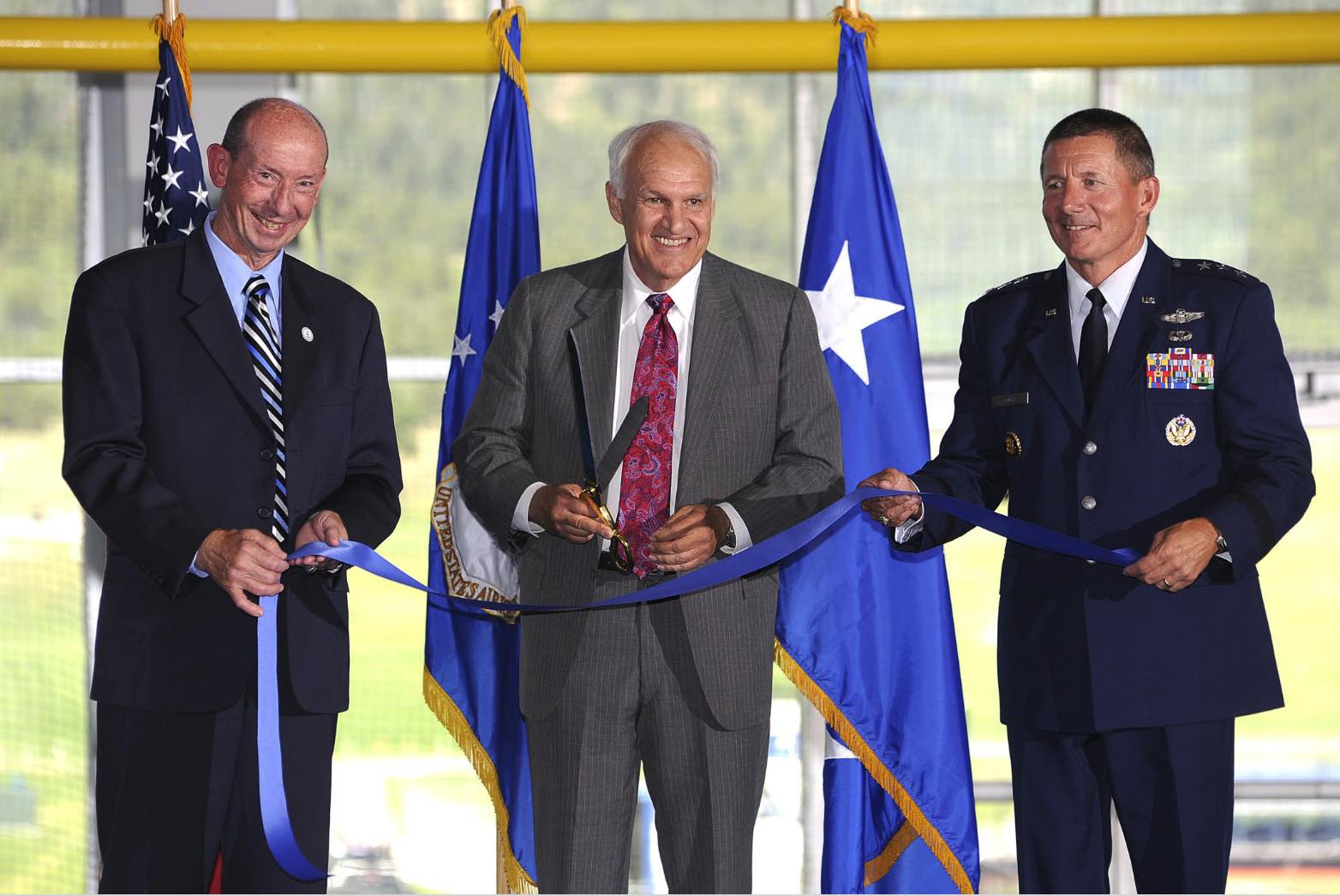 Ribbon cutting ceremony for the Holaday Athletic Center, Bart Holaday (center)