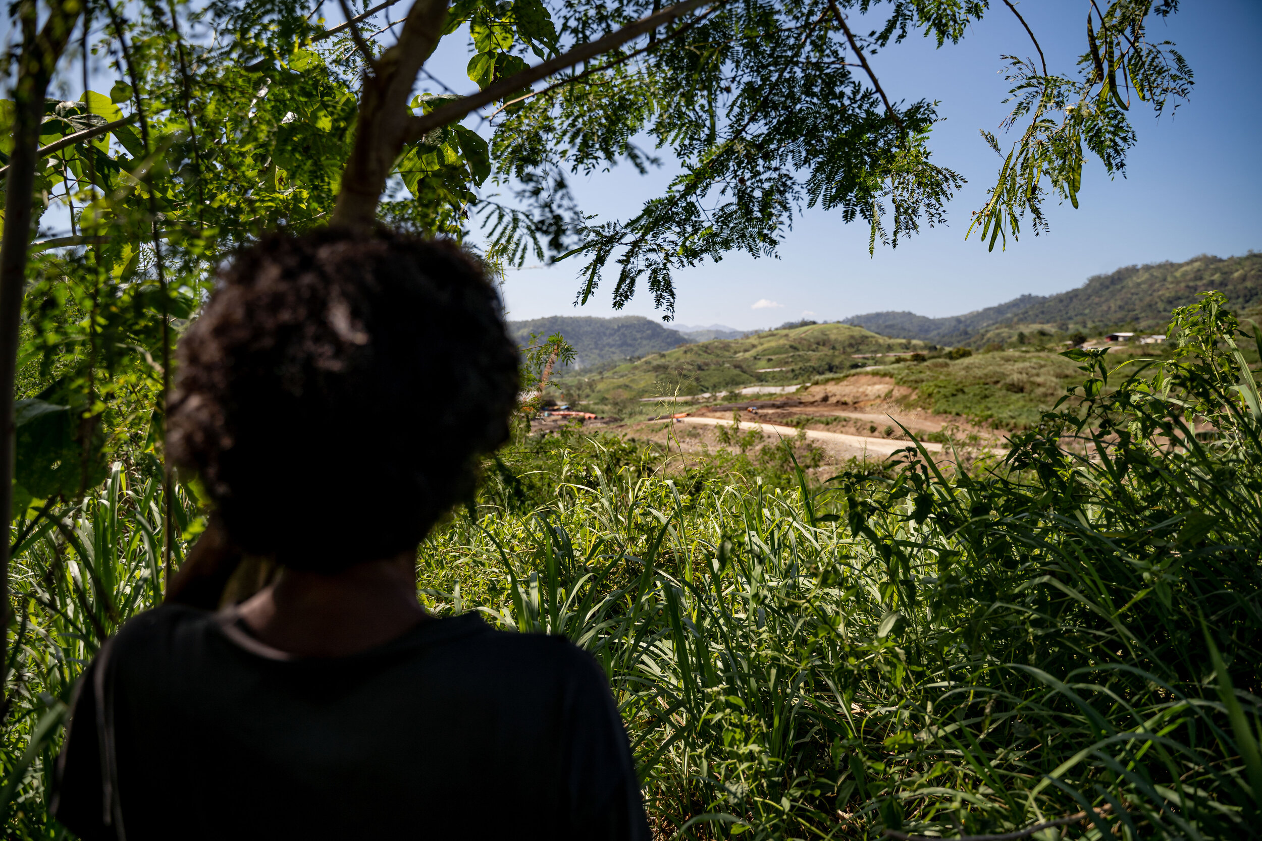  An Aeta looks at a construction site that was once cultivated land in Sitio Alli, Capas, Tarlac. Aeta communities fear their natural cultural markers are being demolished with the construction of the New Clark City project. 