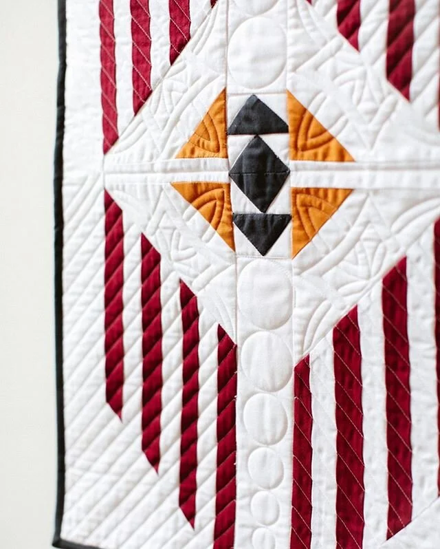 Have you seen the unbelievable custom quilting that @jcoterie did on the July project for Modern Makes? This is such a fun project with an awesome combination of easy to learn skills, and her quilting just set it off perfectly! I can't decide if I li