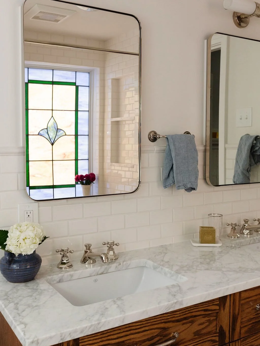 We borrowed space from the large, primary bedroom to enlarge both the bathroom and the closet. The new bath features a wide oak double vanity, a built-in linen cabinet, and a spacious soaking tub.

#interiorrenovation
#primarybathroom
#primarybathroo