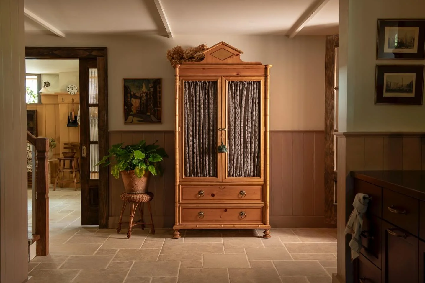 A palette of French limestone flooring, deep wood tones, and bold earthy hues&mdash;yellows, reds, greens, and blues&mdash;balance against soft historic whites and blush-taupe undertones. The furnishings and textiles bring soul to the space, from the