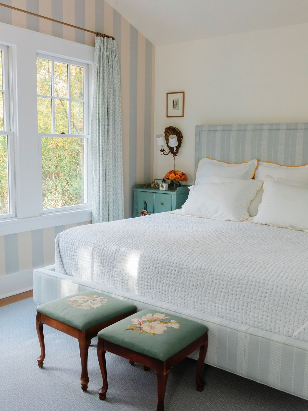 The color palette of soft blues and warm neutrals, punctuated by a punchy touch of tangerine orange, draws inspiration from the homeowners&rsquo; favorite travel destinations. 

Layers of rich texture and pattern&mdash;introduced through custom carpe