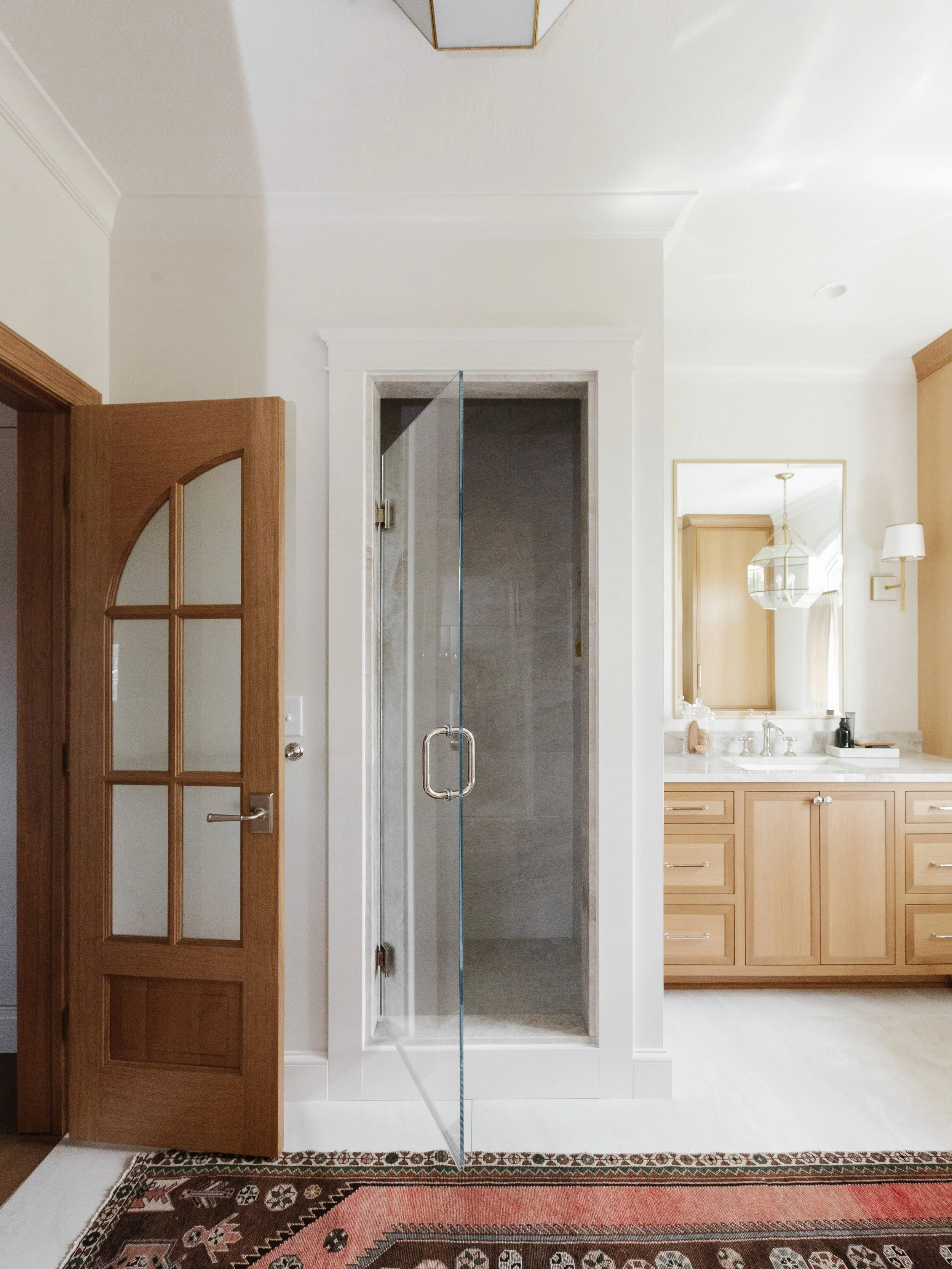 The design balances feminine softness with masculine structure, layering elegant neutral finishes and rich textures to create a peaceful retreat from the demands of busy family life. 

Tile: @ceramiche_tile 
Plumbing: @dons_watersource 
Vintage area 